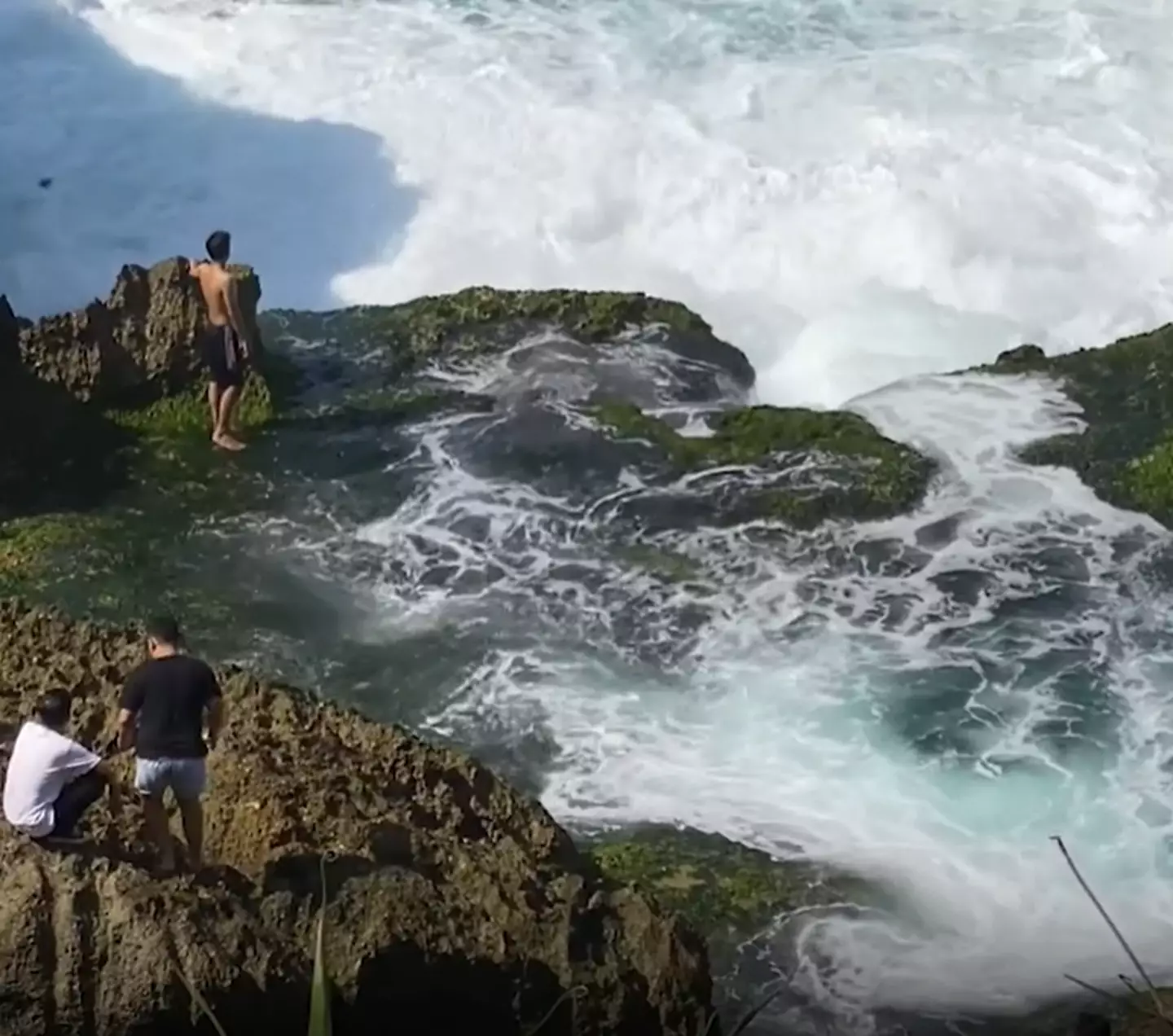 21-year-old Rony Josua Simanjuntak was standing by the sea (Asia Pacific Press via Viral Press)