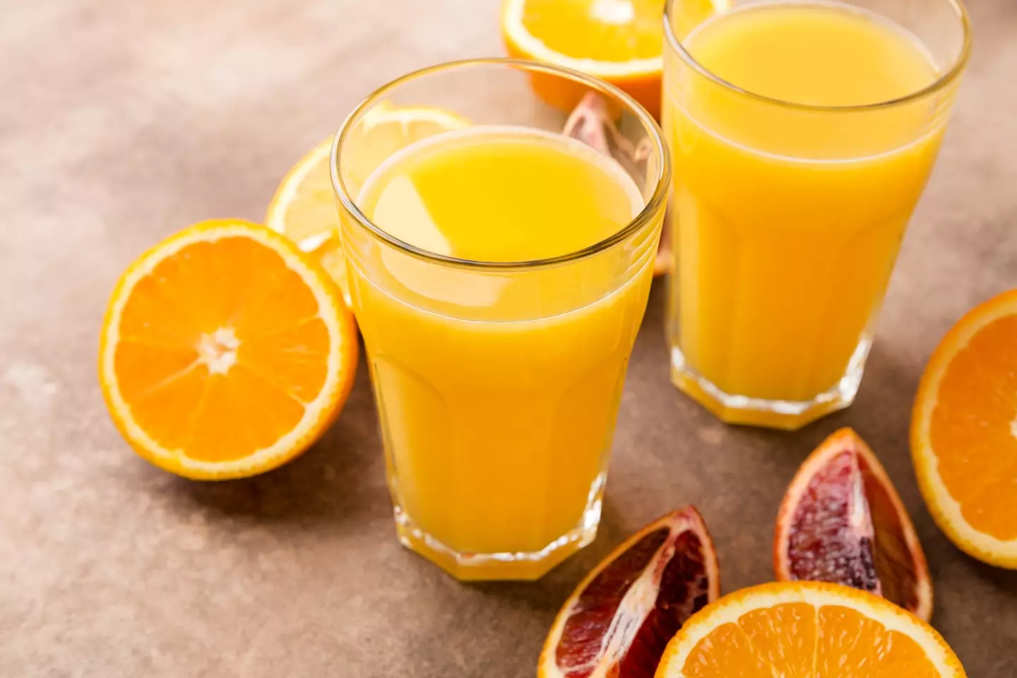 "You could become a millionaire too, you just have to buy us first. The orange juice will sort it out for you." (Getty Stock Photo)