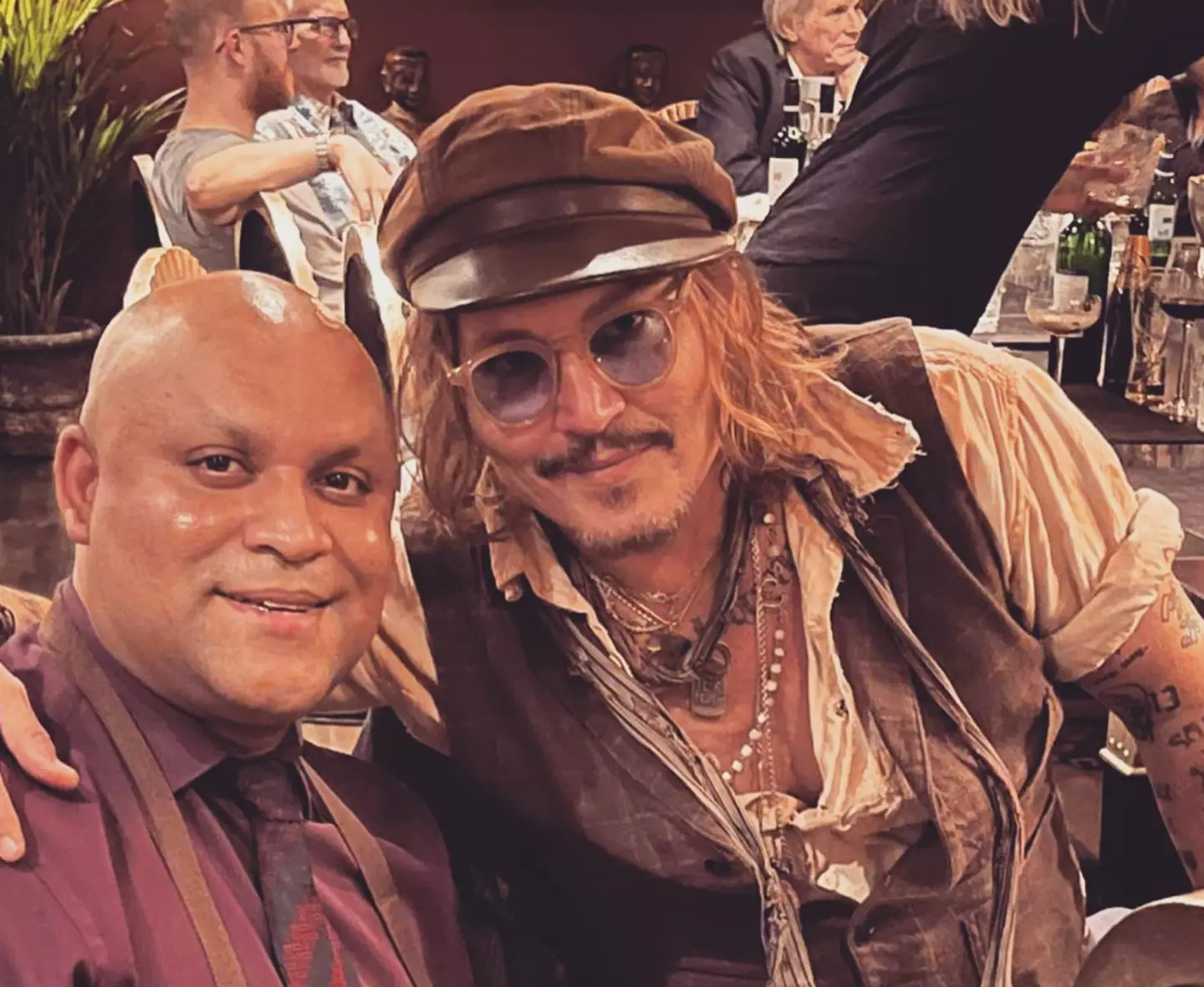 Depp posed for multiple photos at the restaurant.