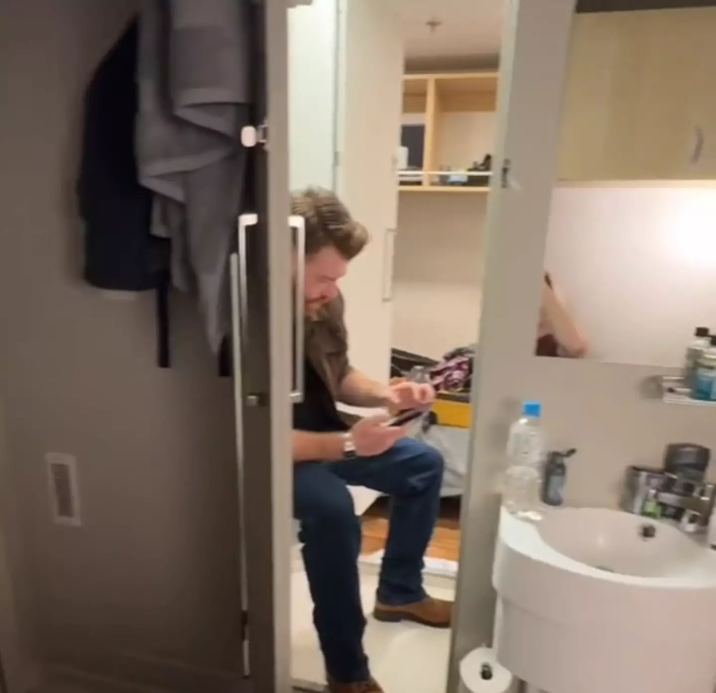 The tiny shared toilet and shower room (TikTok / @bryanjamescruises)