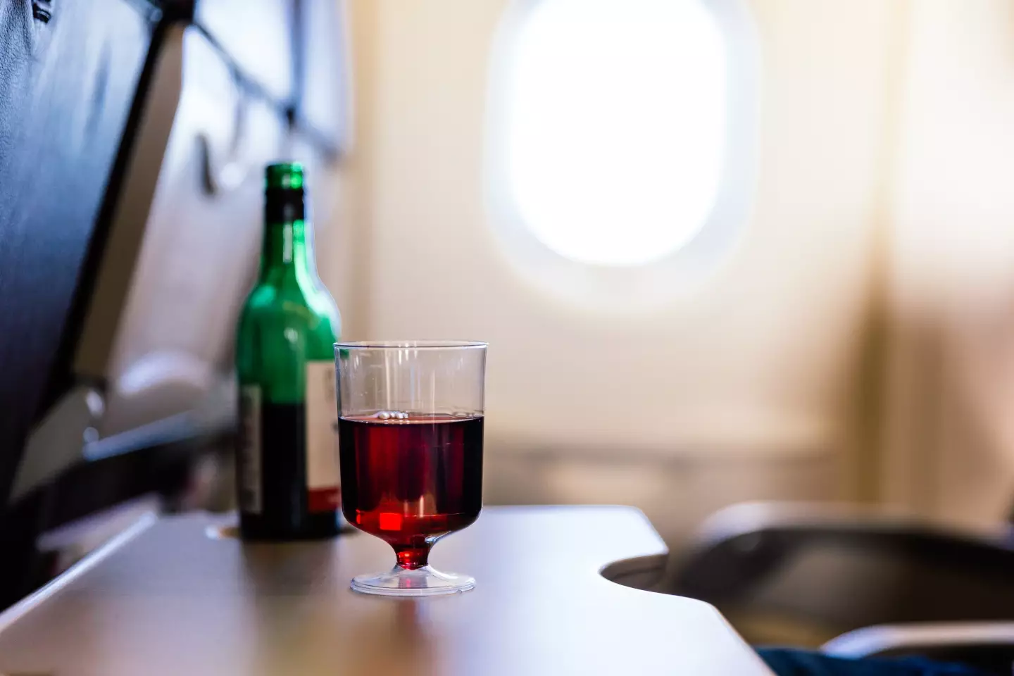 The passenger wanted to enjoy a glass of red on the flight.