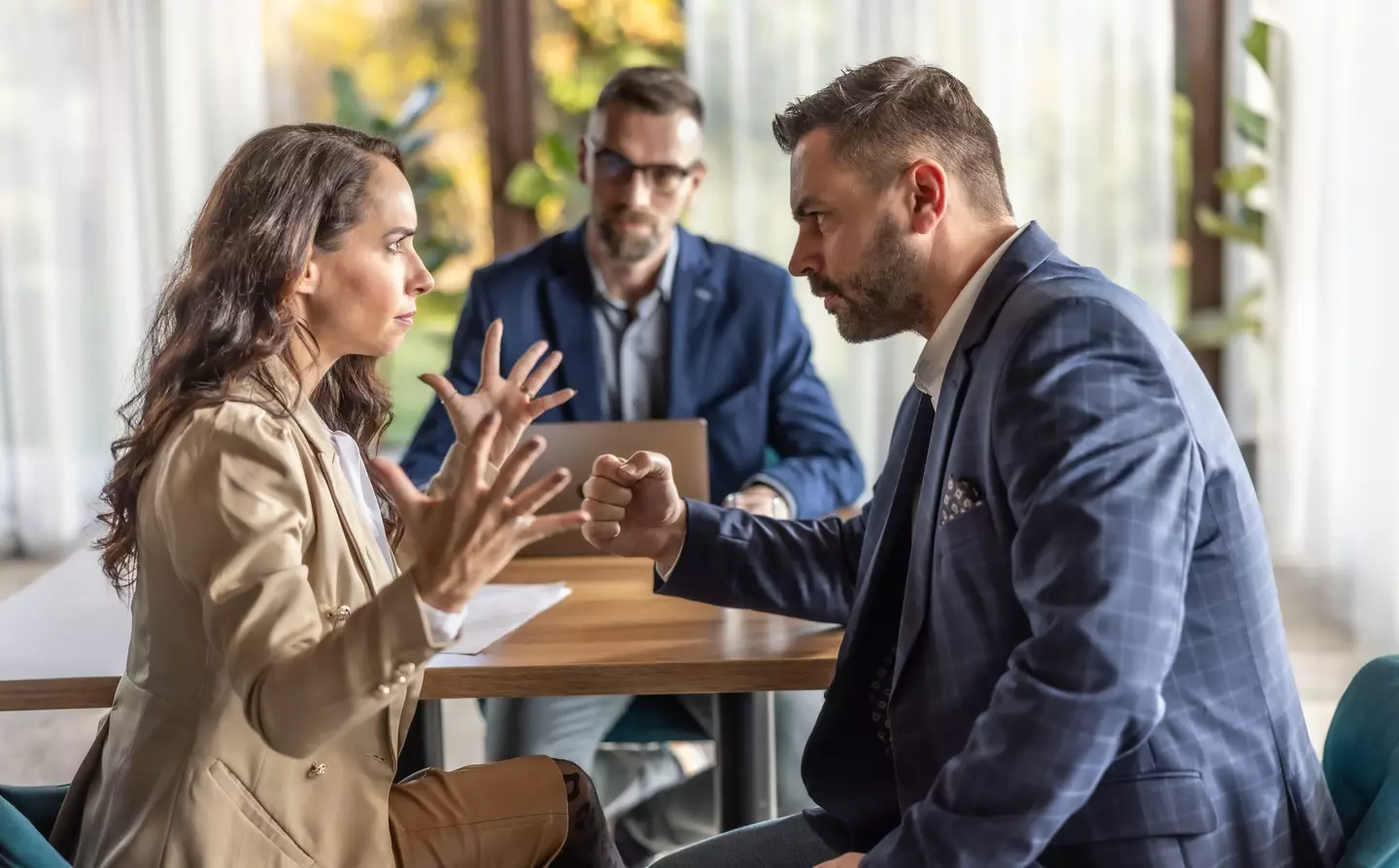 "You don't always need to 'win' every conversation. Why would I want to talk to someone determined to make me lose?" "Guys, can you quiet down? I'm trying to work." (Getty Stock Photo)