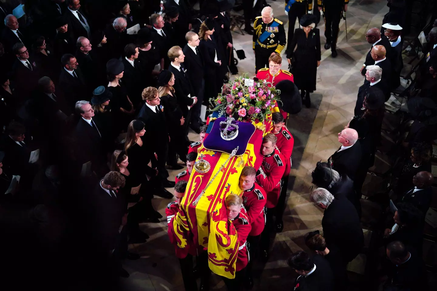 King Charles III at the casket of his mother, Queen Elizabeth II.