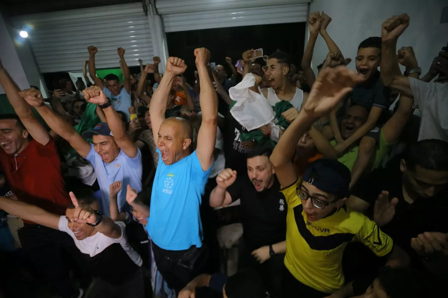 Locals in the Algerian village where Imane Khelif grew up cheering her semi final victory (Hamza Zait/Anadolu via Getty Images)