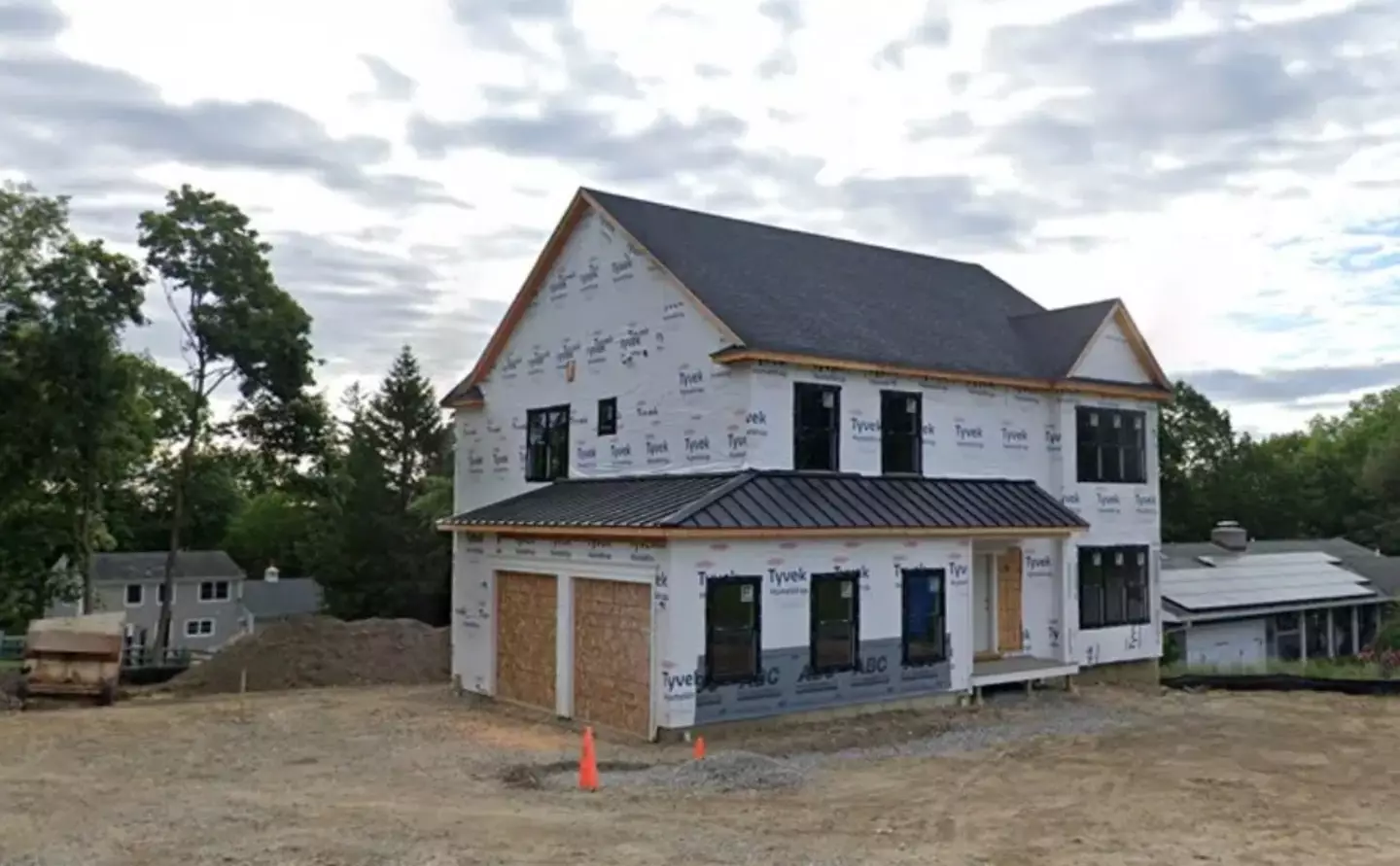 The man who owned the land came back to find someone building a house on it.