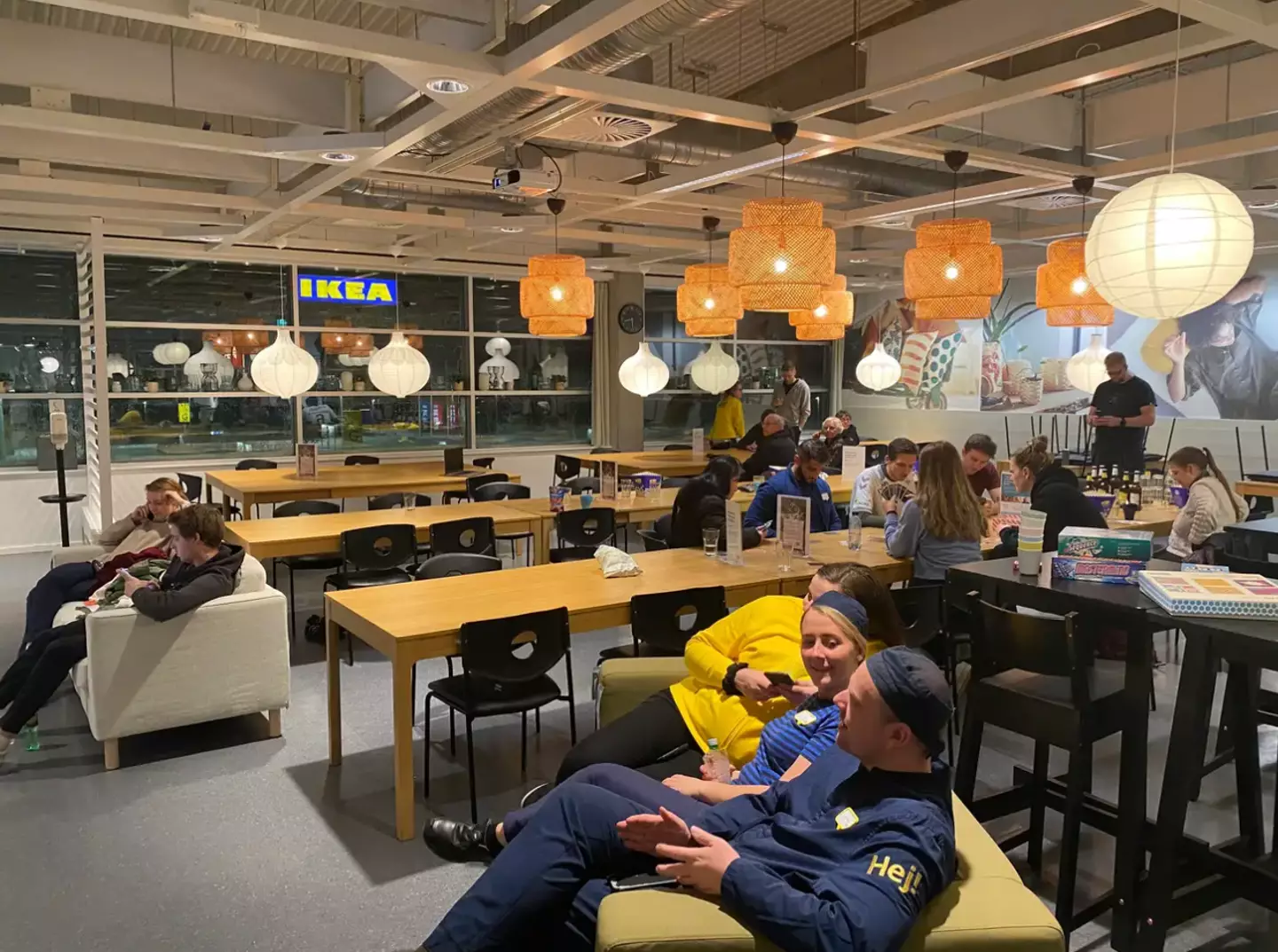 Members of staff and customers making the most of their time stuck inside IKEA.