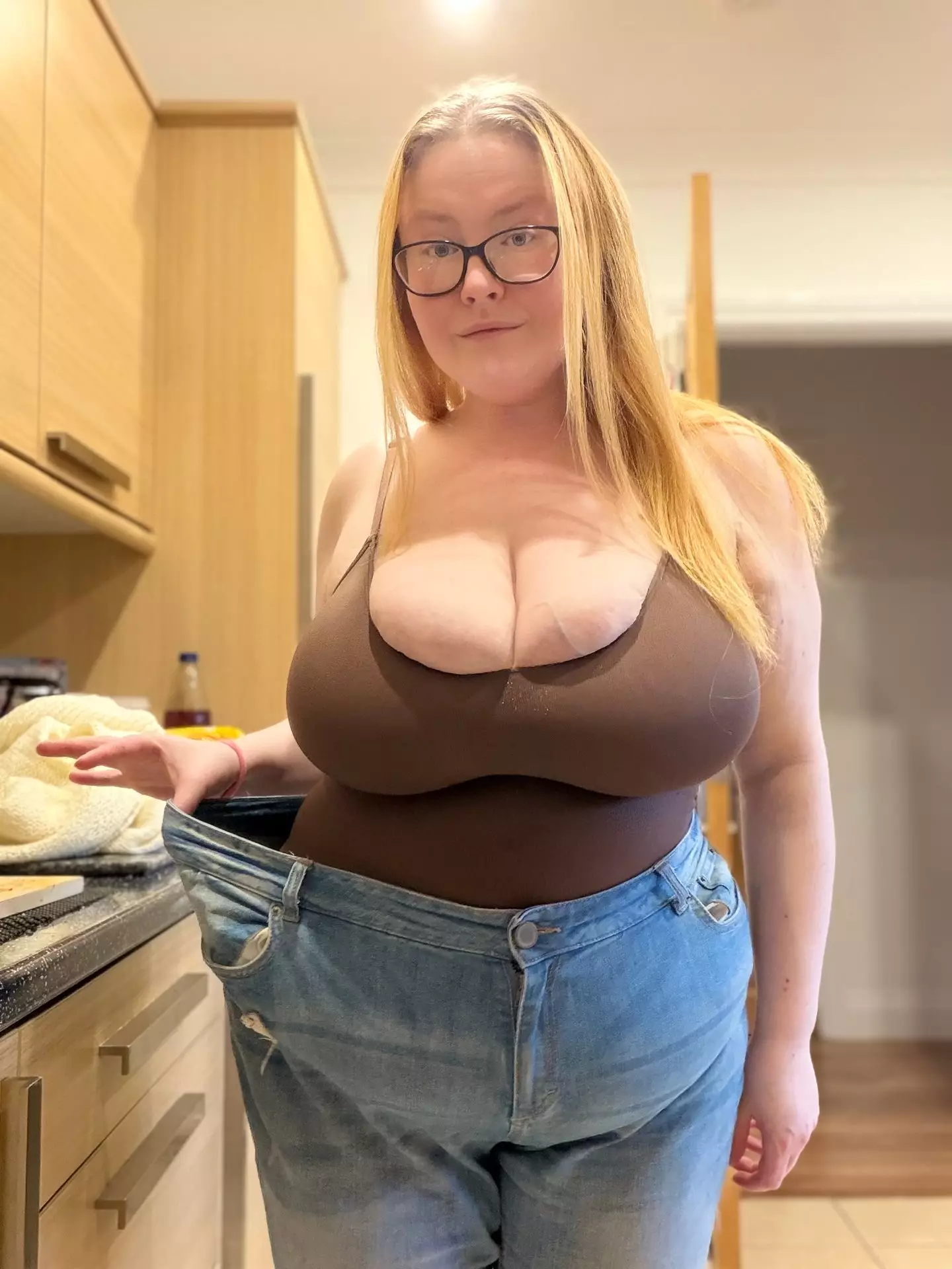 She lost five stone with the help of Mounjaro, but her breasts ballooned to size 34NN (SWNS)