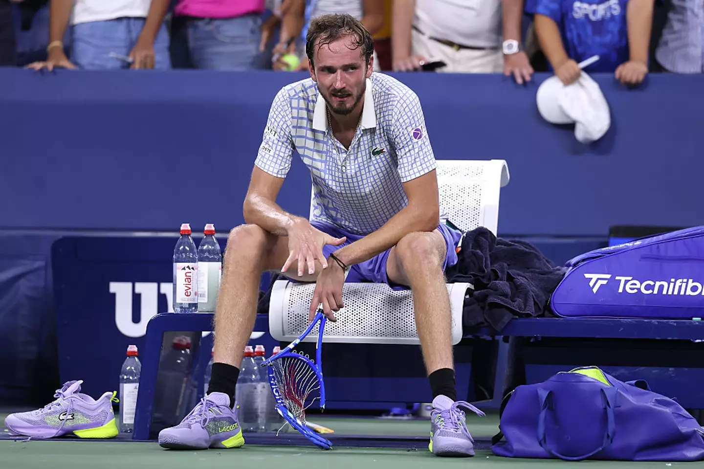 Medvedev and his smashed racket after the game concluded (Elsa/Getty Images)