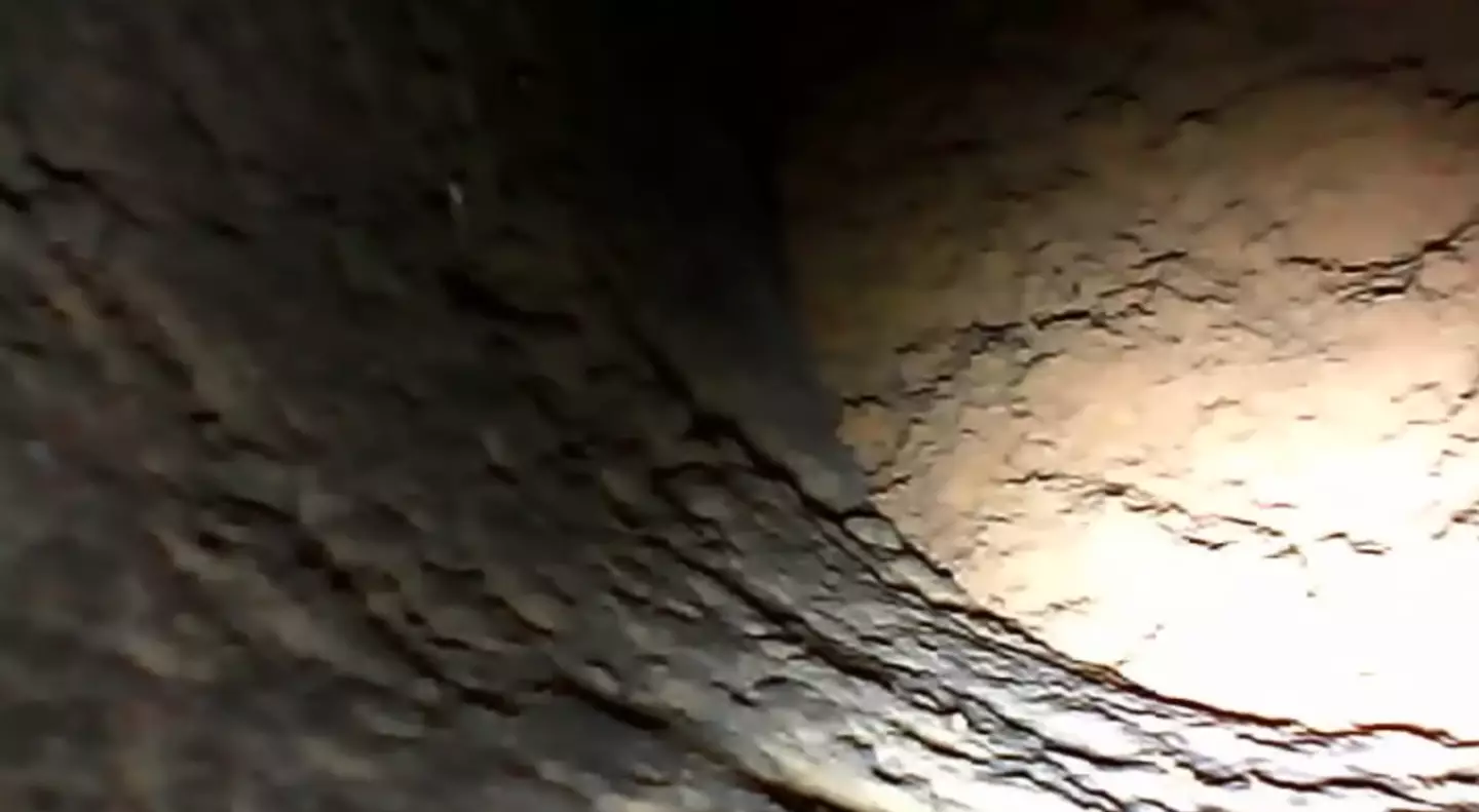 The rock was completely dark, but objects thrown down the hole were never found. (Youtube/Dr. Ty)