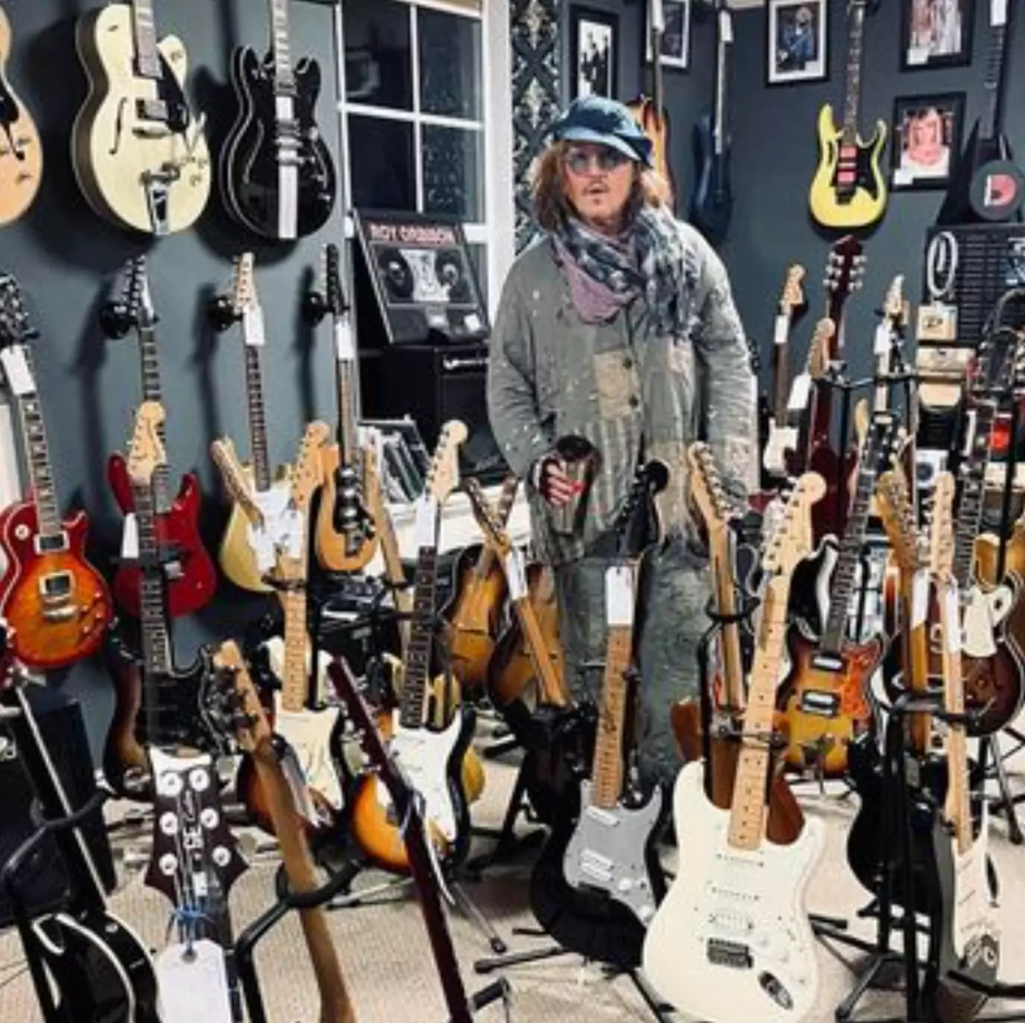 The Hollywood actor tried out several guitars.