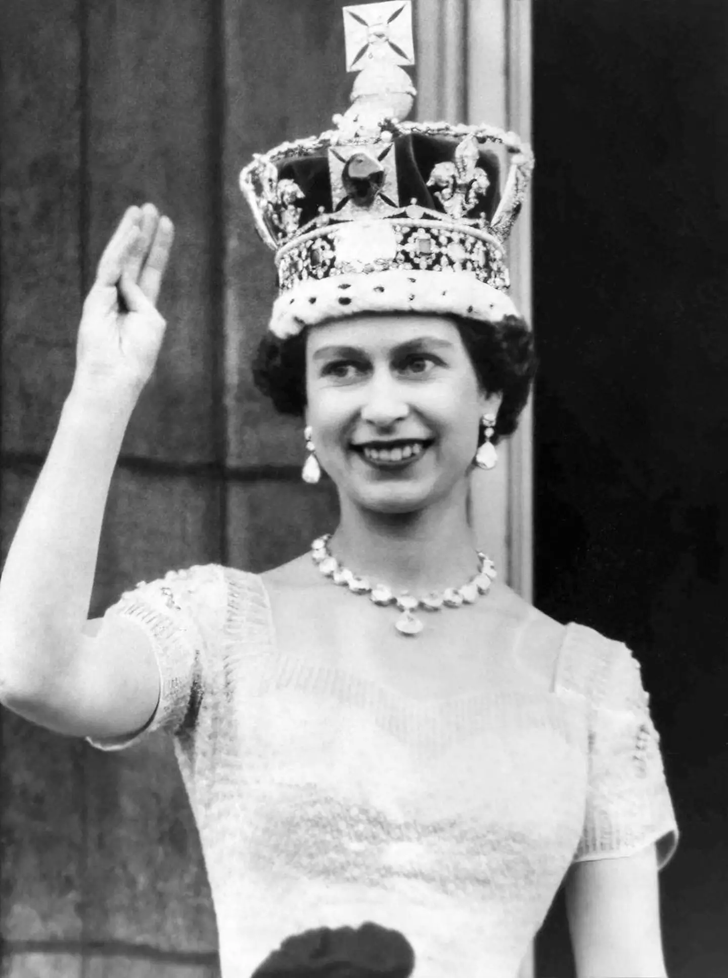 Queen Elizabeth II waves from the Buckingham Palace balcony after her Coronation on June 2, 1953 in London, England.
