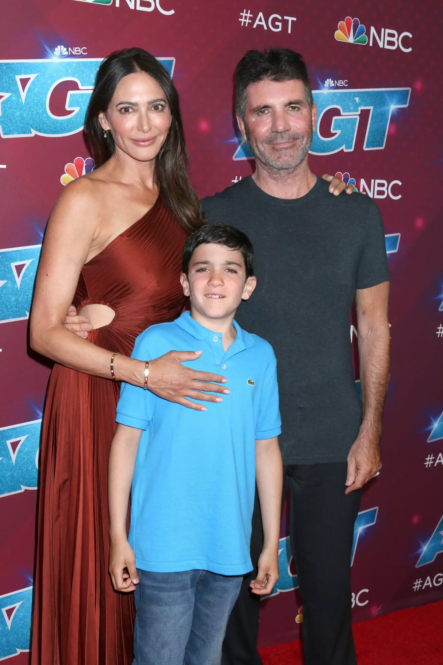 Simon Cowell with fiancée Lauren Silverman and son Eric.