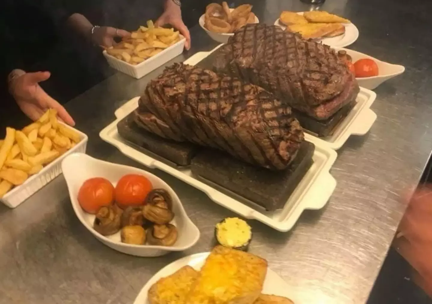 A four person steak challenge needs you and three mates to eat 200oz of steak and sides in an hour.