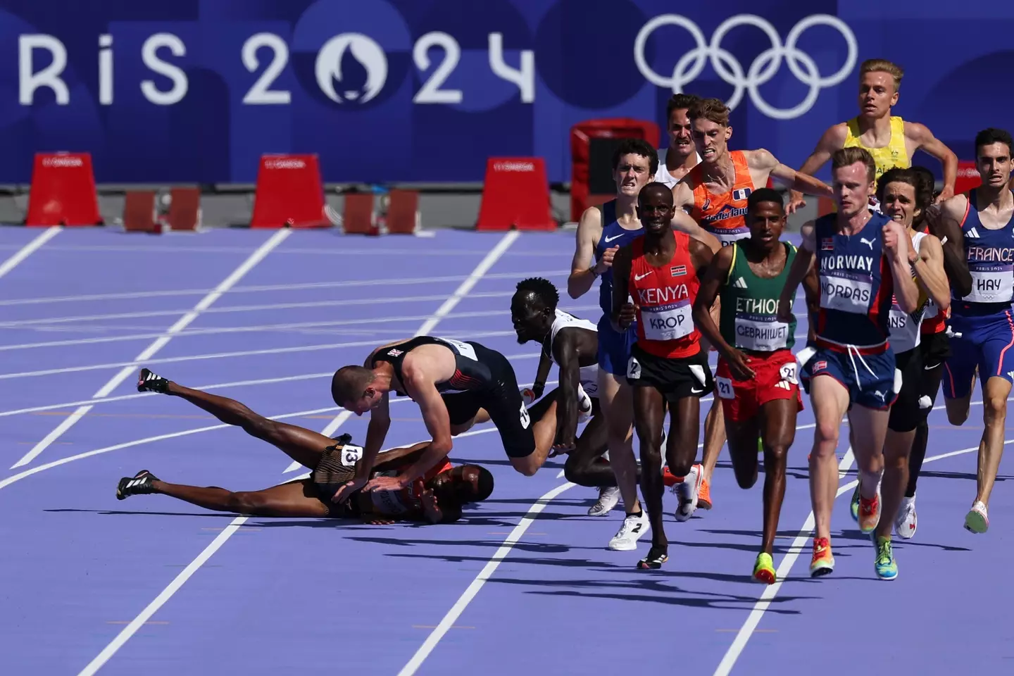 George Mills was thrown to the floor during the Men's 5,000m heats alongside Spain's Thierry Ndikumwenayo (Al Bello/Getty Images)