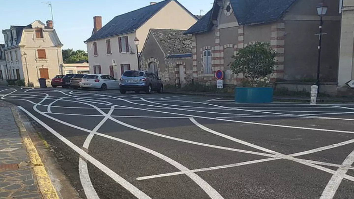 Village paints 'squiggly lines' on roads to stop cars from speeding