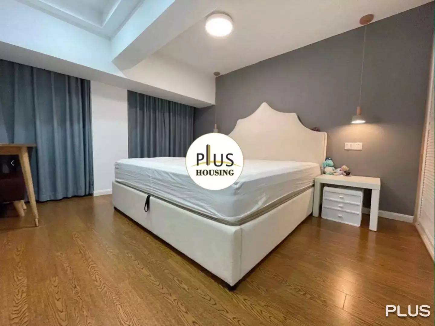 You'll have to figure out whether those curtains are drawn to keep out light, or to hide the fact there's no windows (Plus Housing)