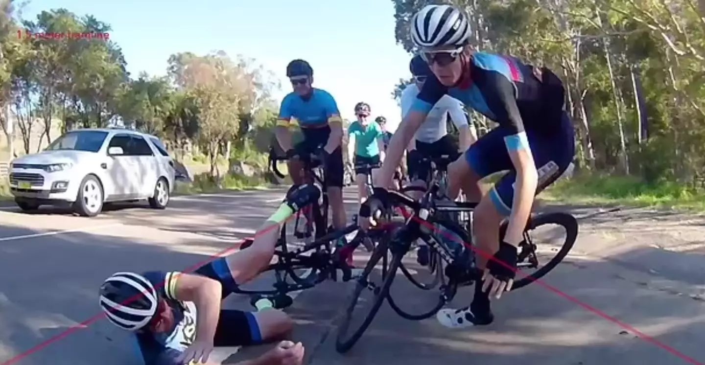 The lead rider crashed into the main road, but was able to scramble back into the shoulder.