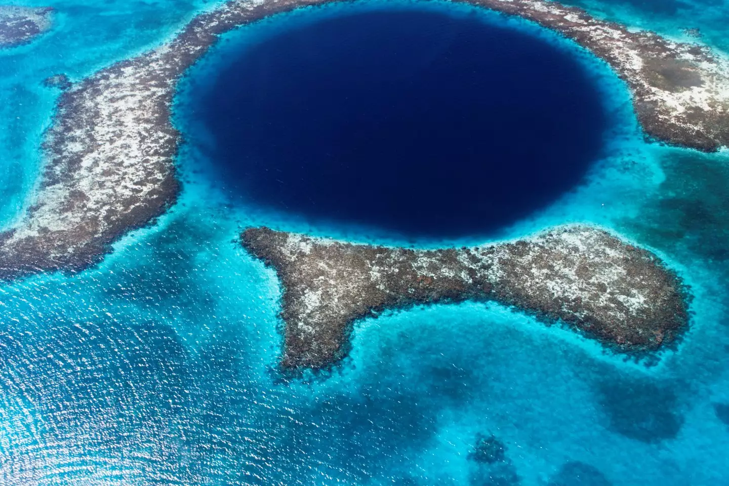 The Great Blue Hole is located off the coast of Belize in Central America, near the centre of Lighthouse Reef (Getty Stock Images)