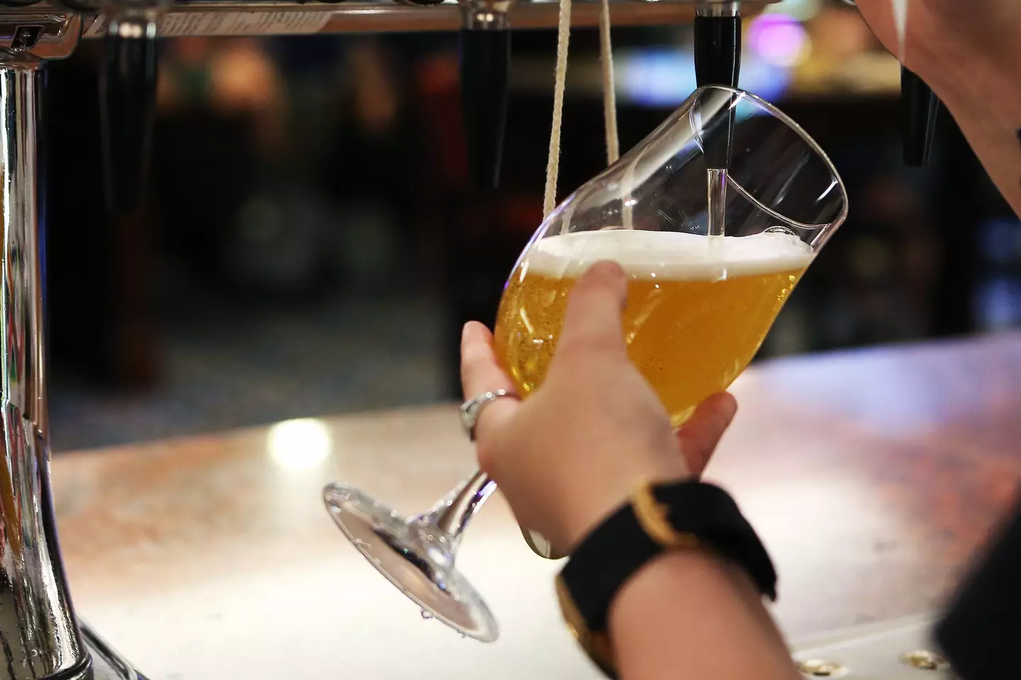 A pint being poured in a Spoons pub.