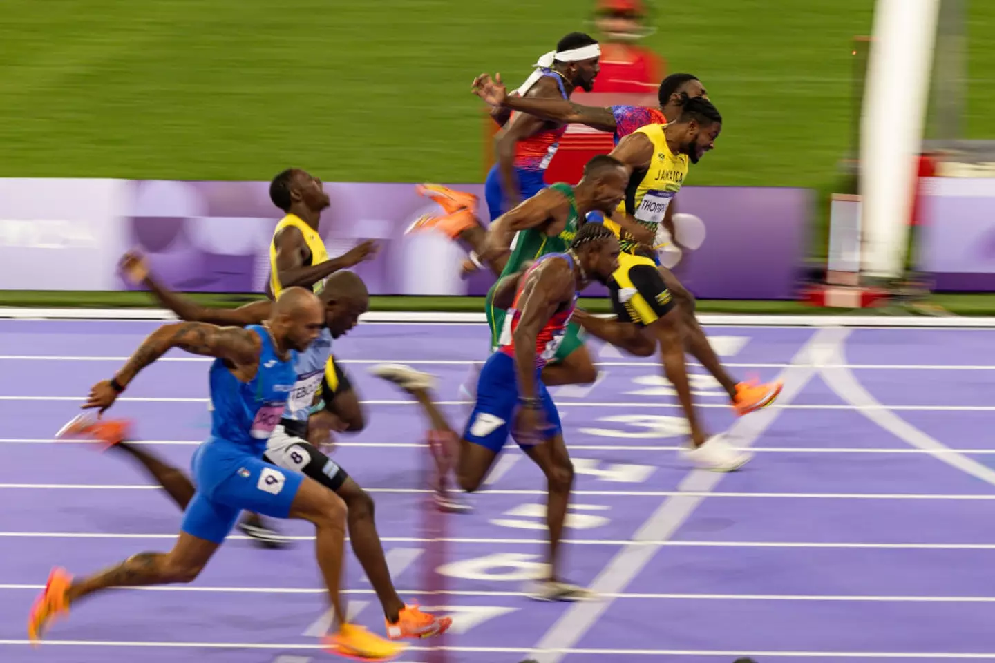 The winner was decided not by Thompson's foot, but instead Lyles' chest. (Rodolfo Buhrer/Eurasia Sport Images/Getty Images)