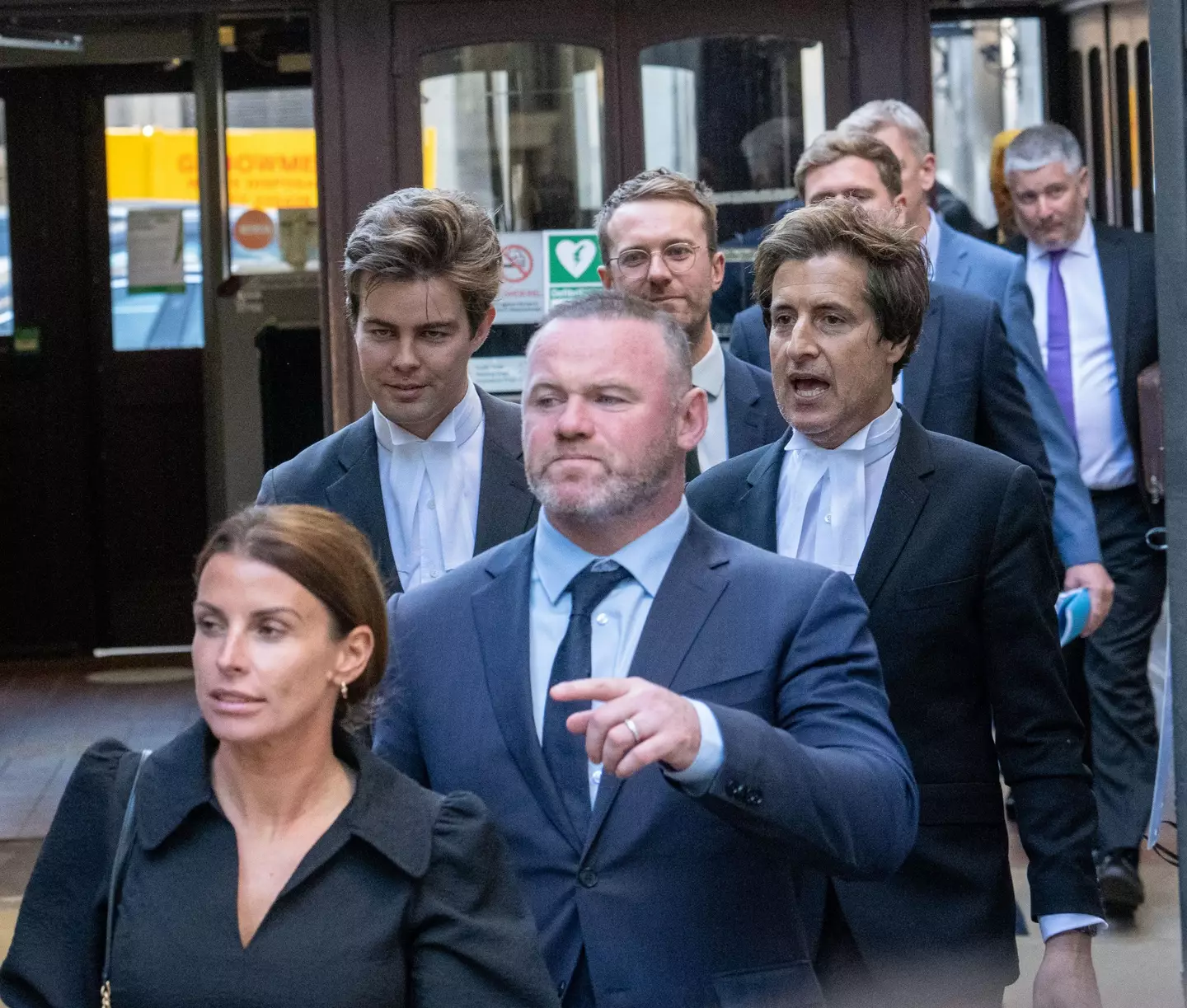 Colleen Rooney and her husband Wayne leaving court.