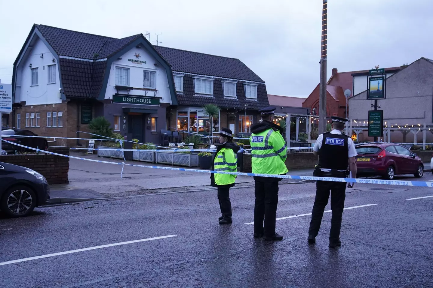 Police outside The Lighthouse Pub in Wallasey Village.