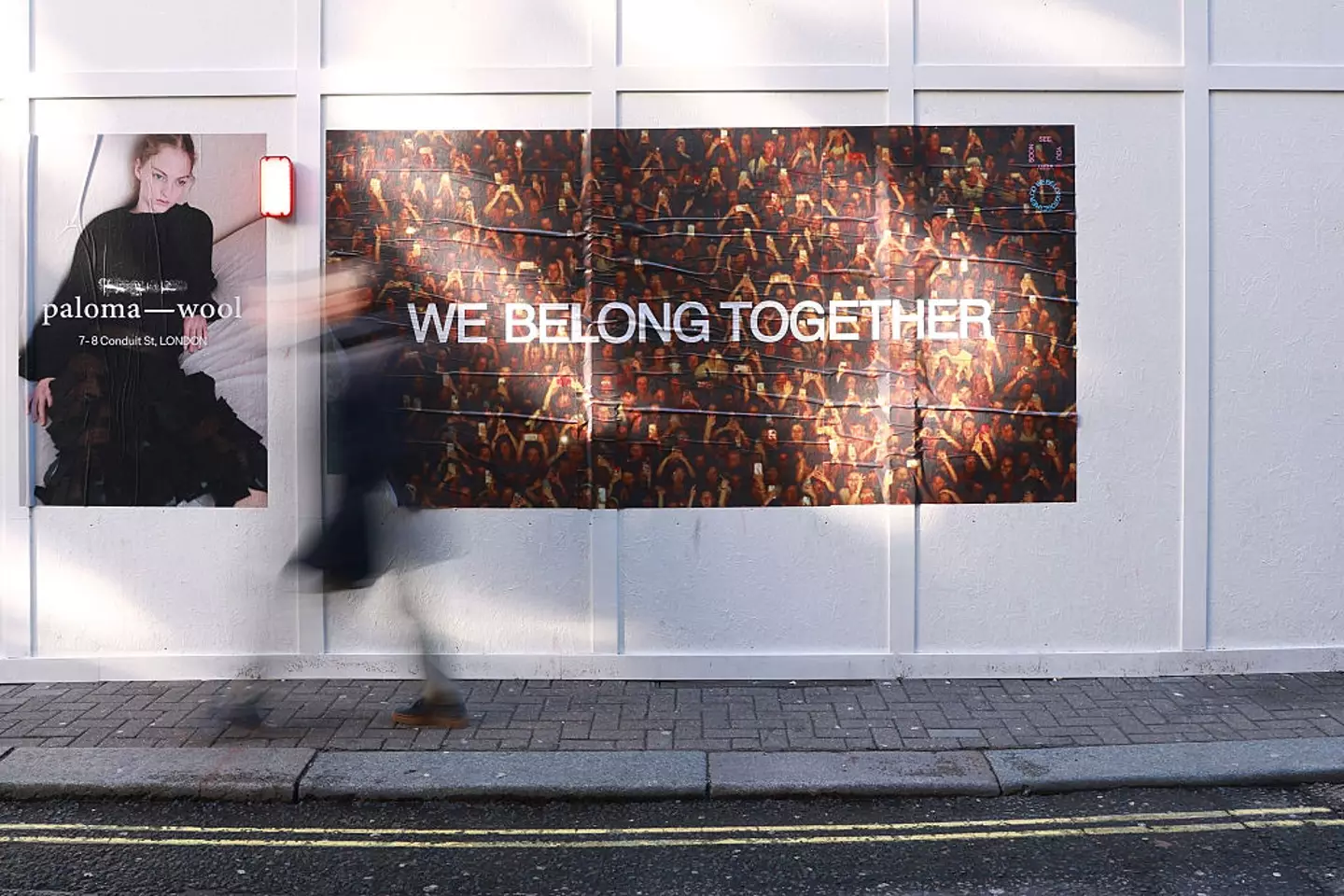 'We Belong Together' posters have popped up in cities around the world (Lia Toby/Getty Images)