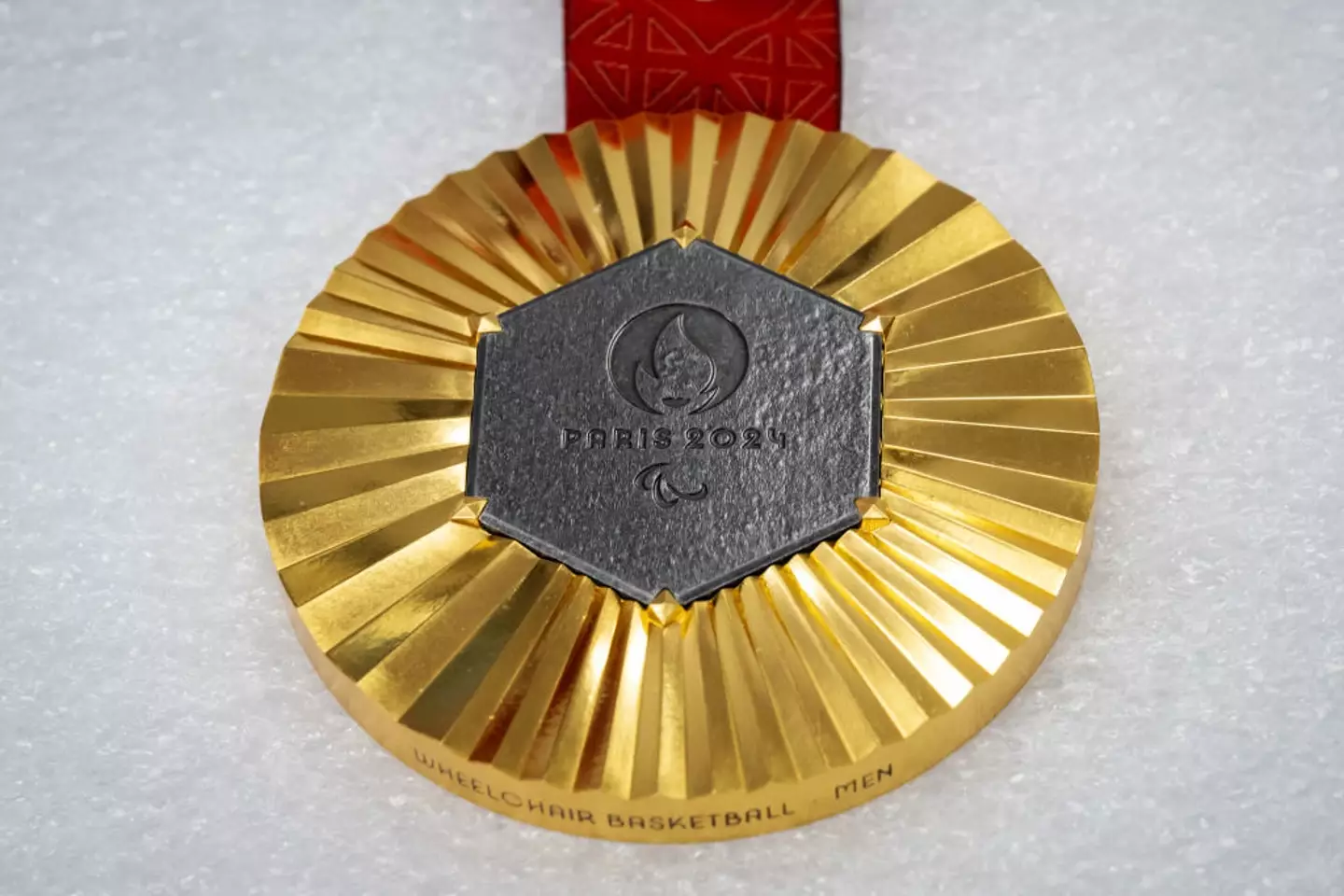 Each medal contains original metal from the Eiffel Tower (BERTRAND GUAY/AFP via Getty Images)