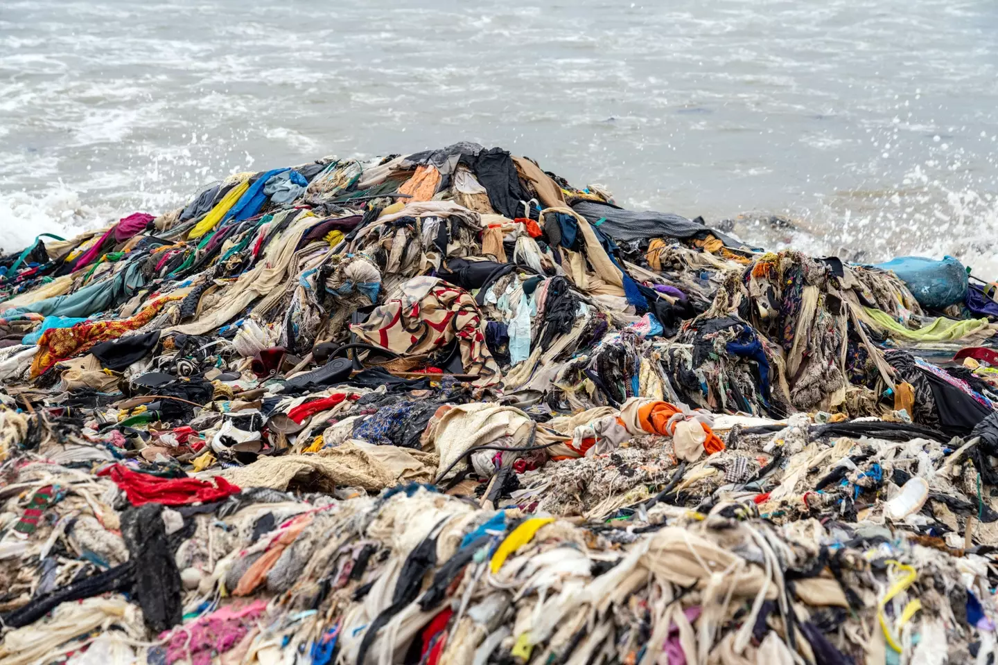 A mountain of unwanted clothes is clogging up the beaches of Ghana's capital city.