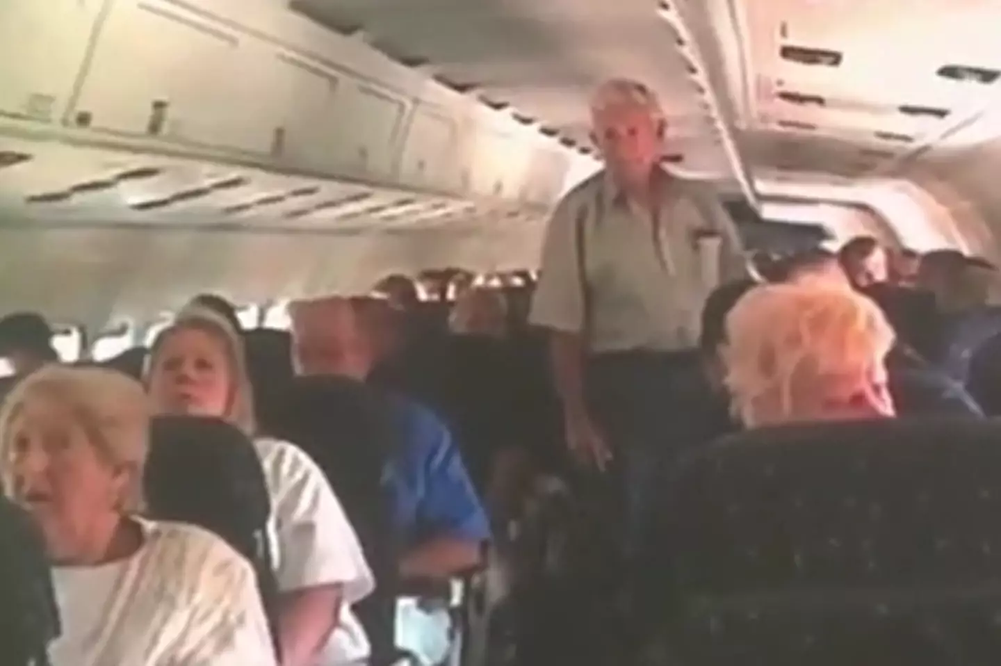 The plane passengers listened with horror at the news of the terrorist attacks.