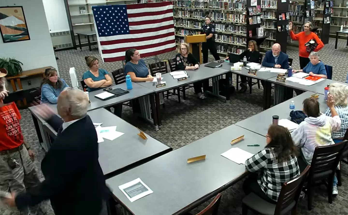 Eventually things descended to a point where a man tried to knock the phone out of Bodnar's hand (YouTube/Regional School Unit 67)