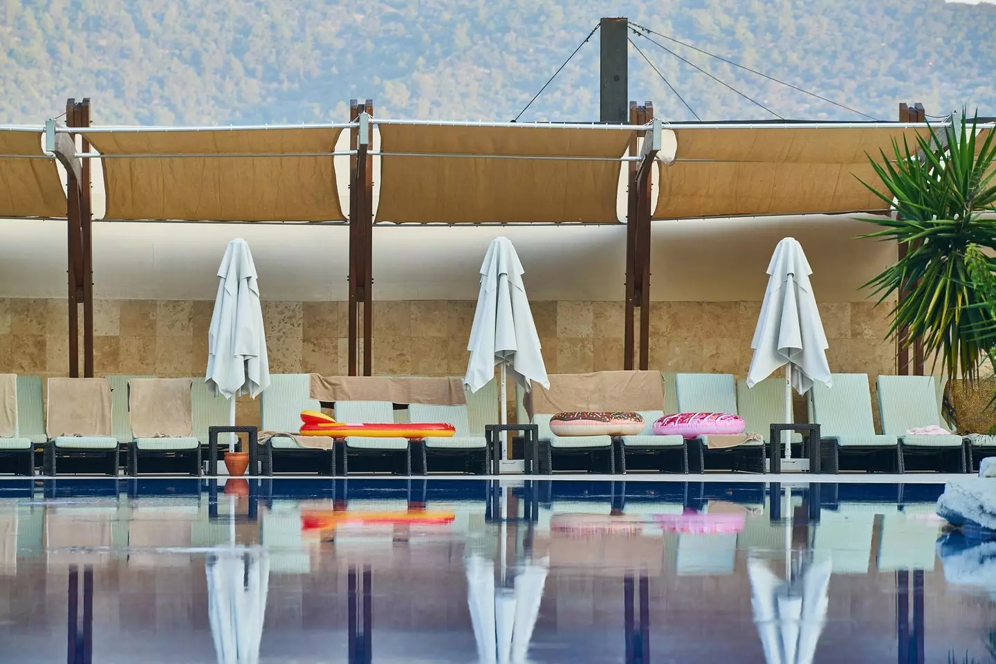 Tourists use towels to save their sunbeds for later in the day.