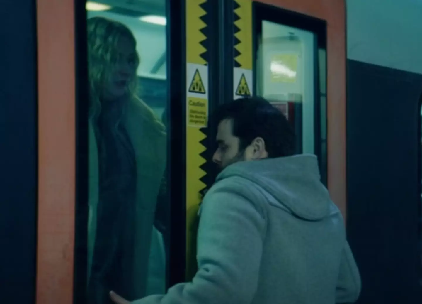 The man's jacket gets caught in the train (BBC)