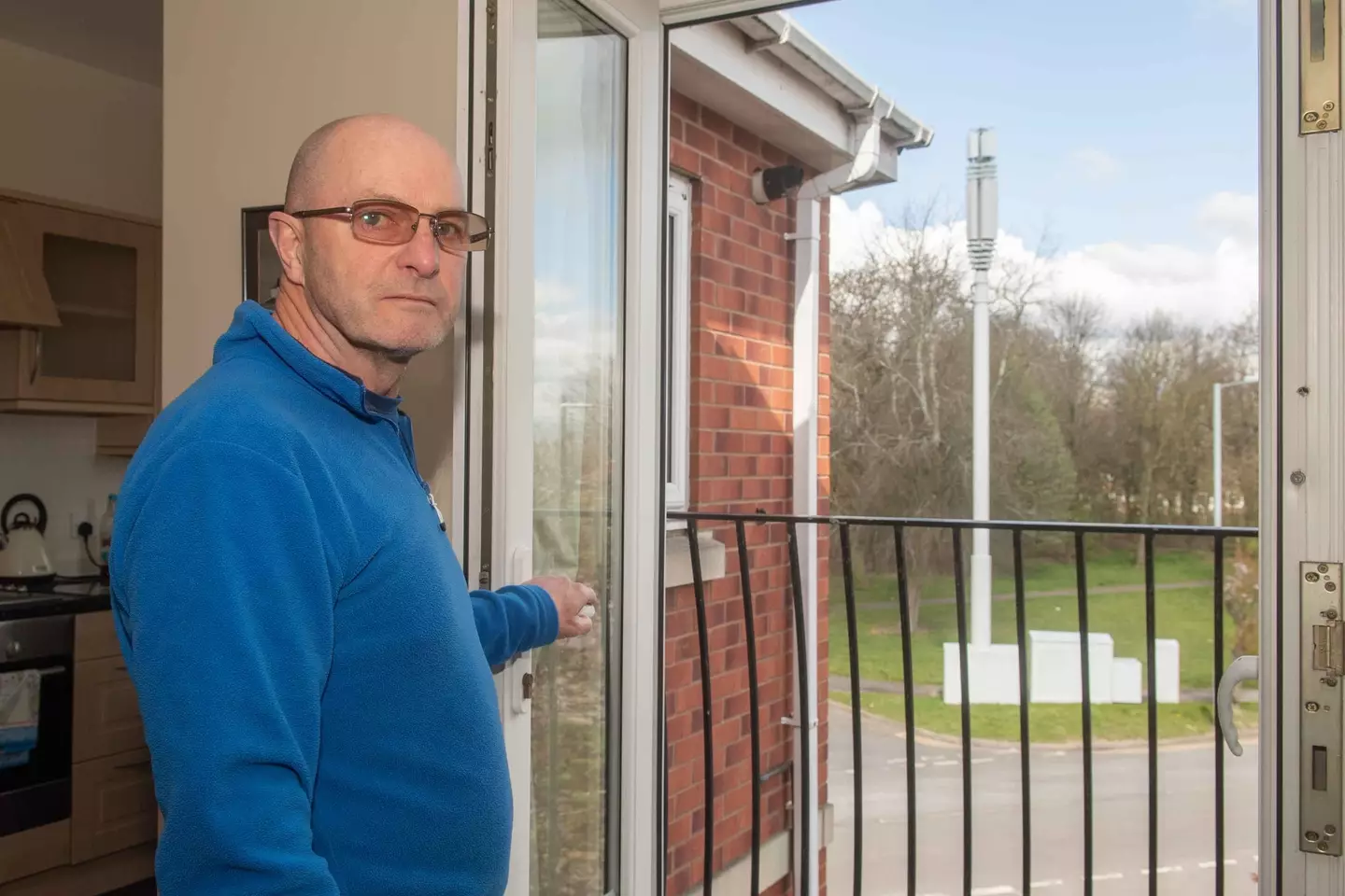 Homeowner Brian Swanson is furious at the 'eyesore' erected outside his flat.