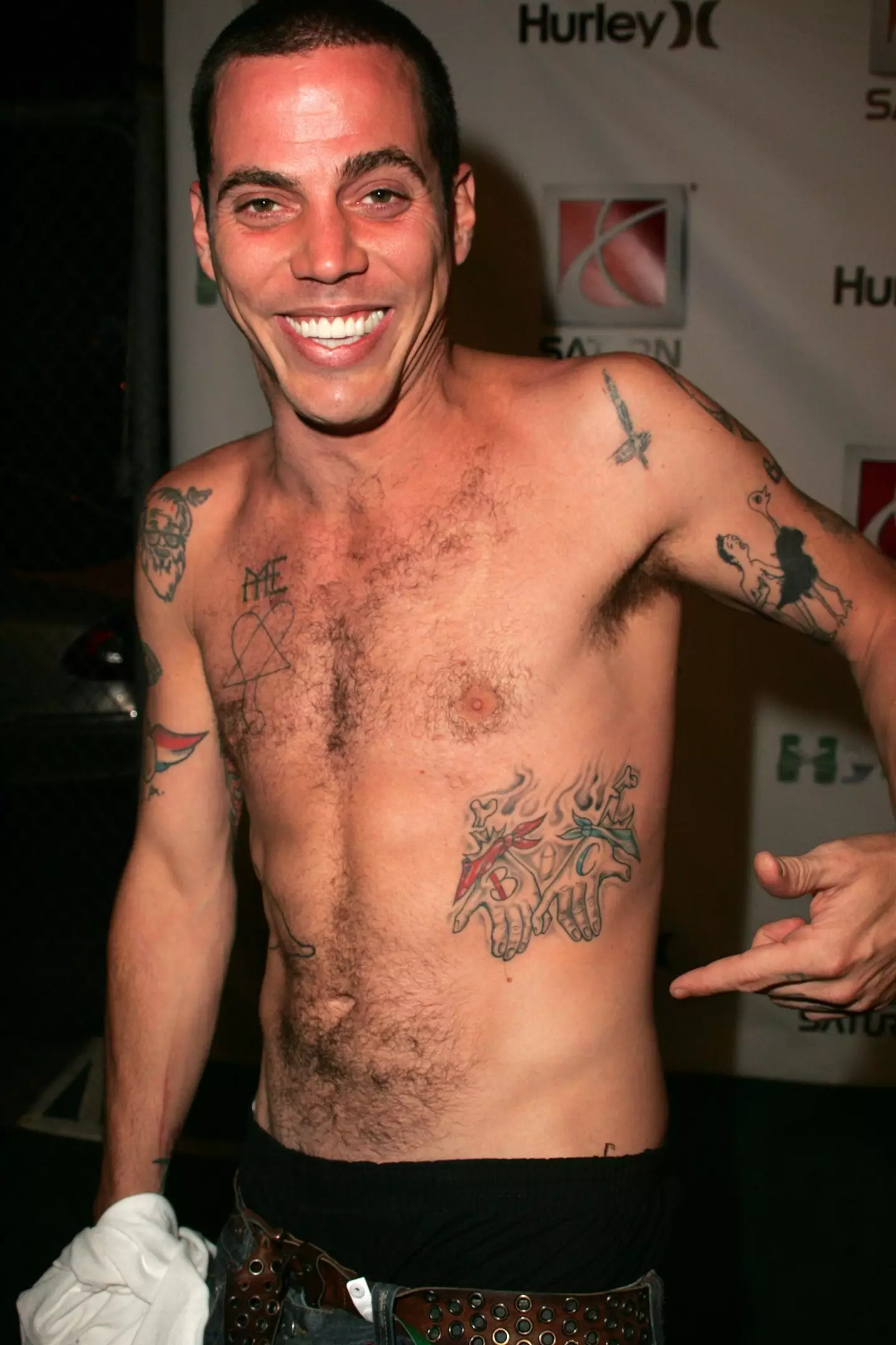 The Jackass star reveals the reason why he had some of his body ink covered up.