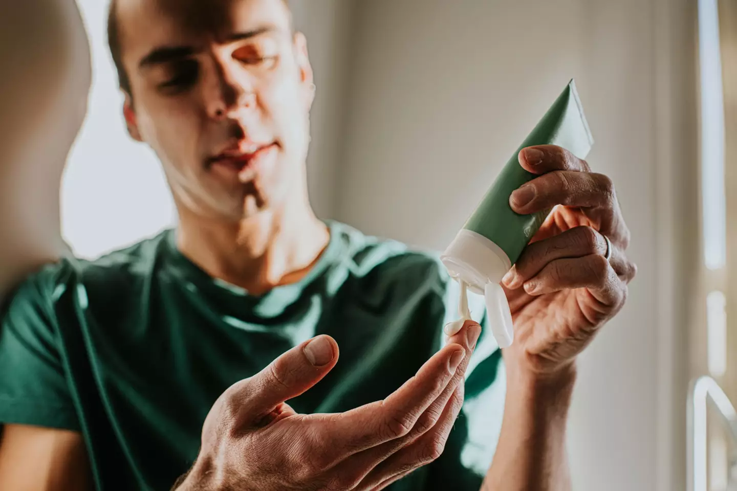 Don't be shy about slapping on the sunscreen. (Getty Stock Photo)