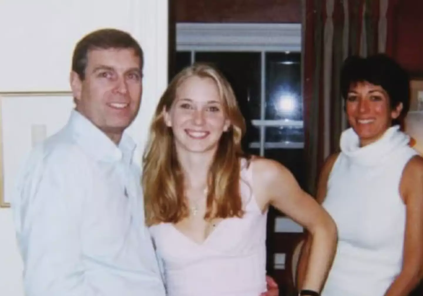 Ghislaine Maxwell has reportedly claimed this photo of herself, Prince Andrew and Giuffre is fake (US Justice Department/PA)
