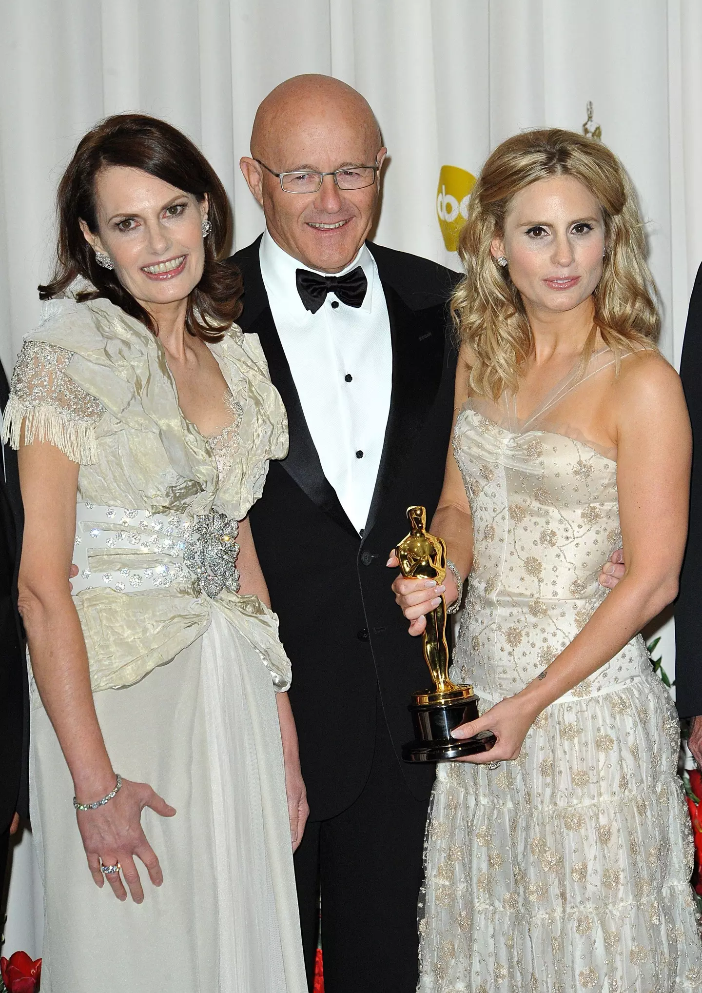Sally Bell (L), Kim Ledger (middle) and Kate Ledger (R) accept Heath Ledger's award for Performance by an Actor in a Supporting Role.