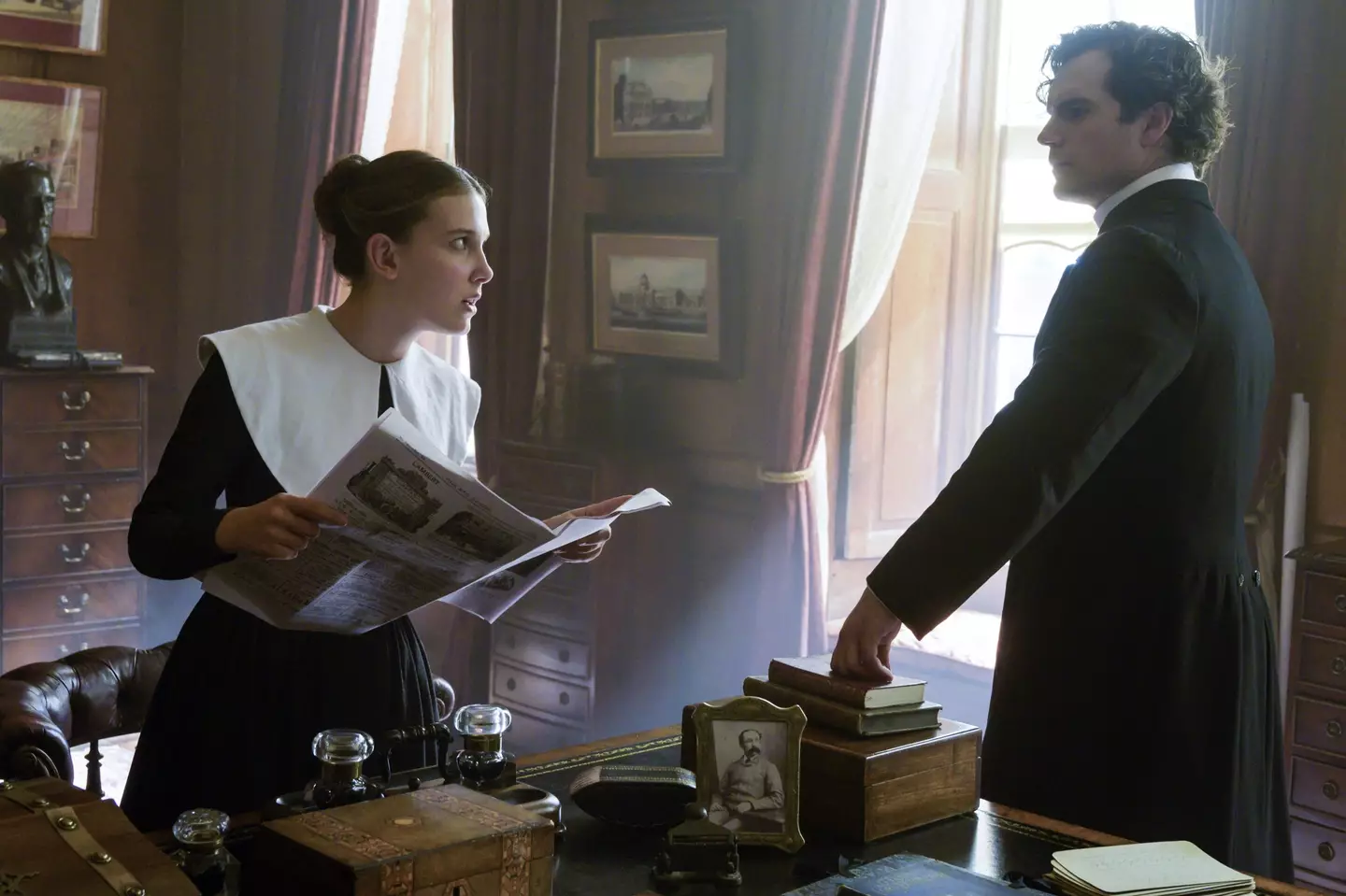 Millie Bobby Brown and Henry Cavill in Enola Holmes.