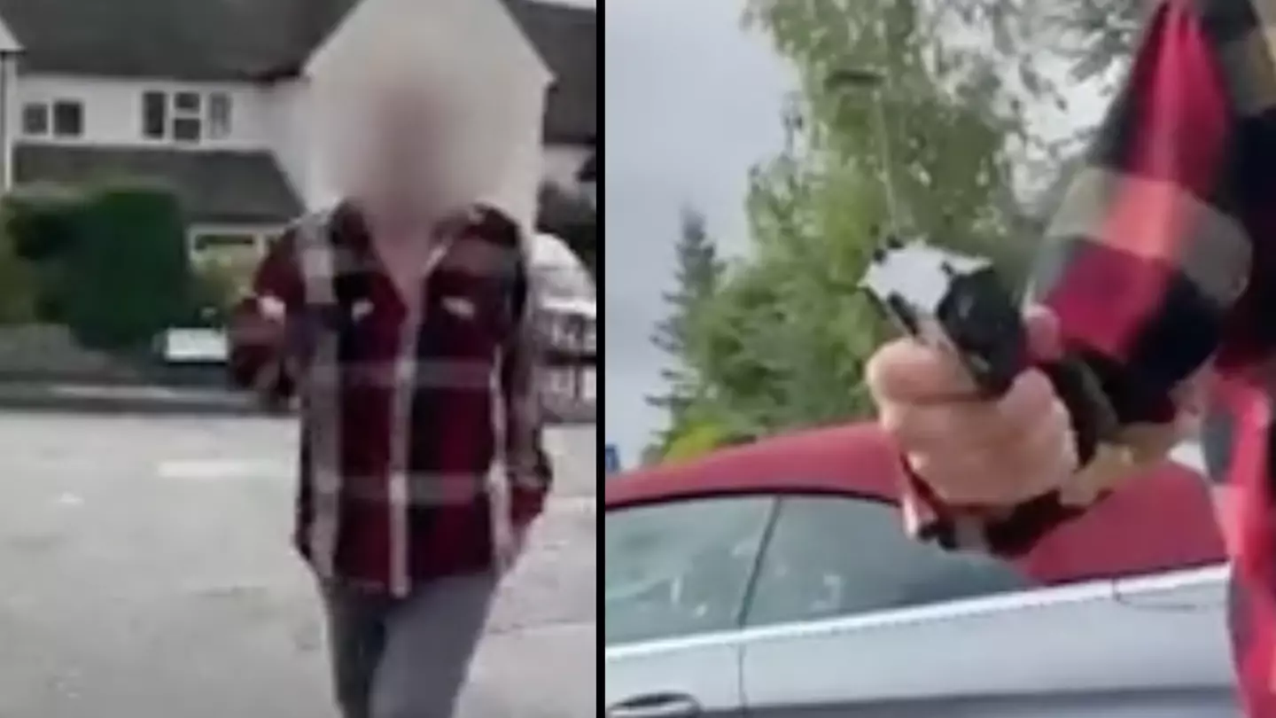 Shocking moment man flying drone in UK town comes face to face with a gunman