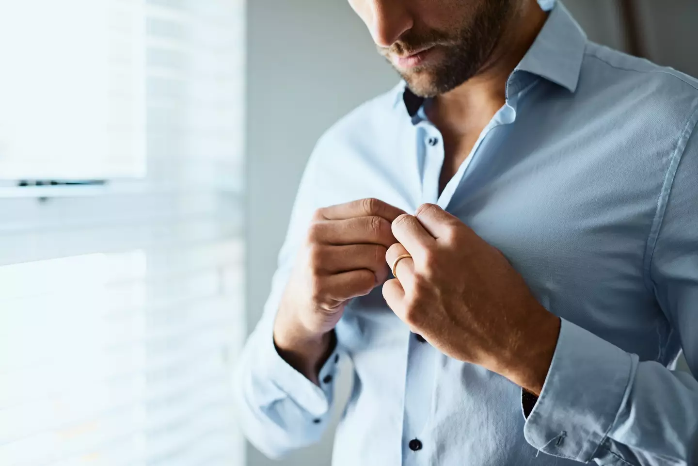 Men's buttons are on the right side of their shirt.