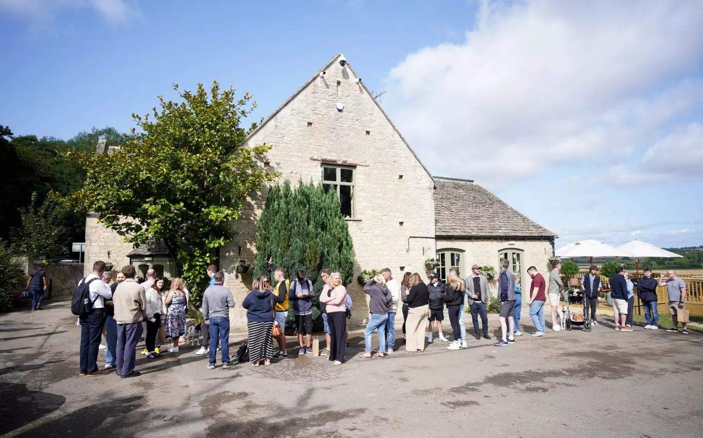 Queues formed before the pub officially opened (Ben Birchall/PA Wire)