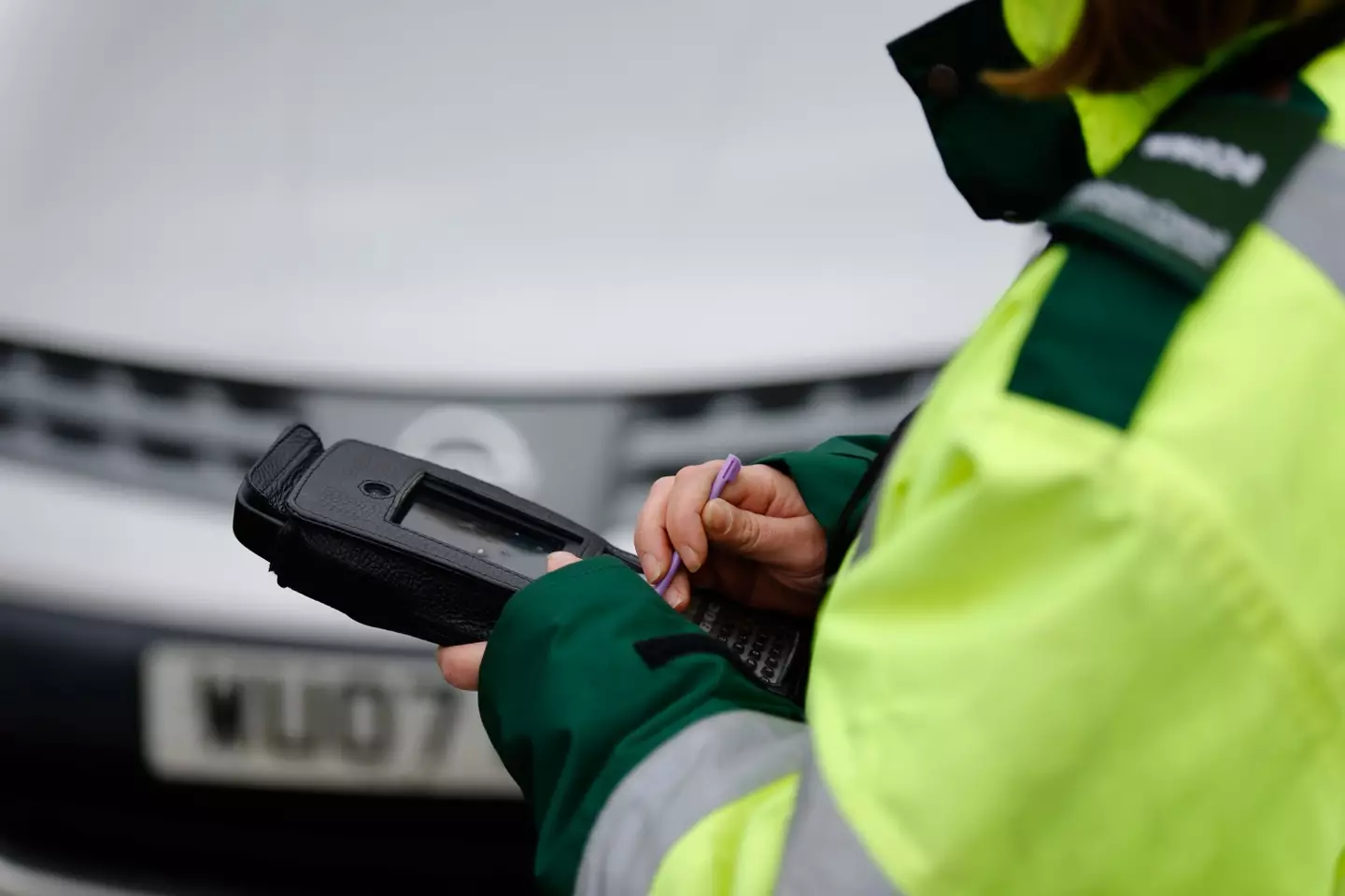 The warden hit the resident with fine, despite being parked outside his home.