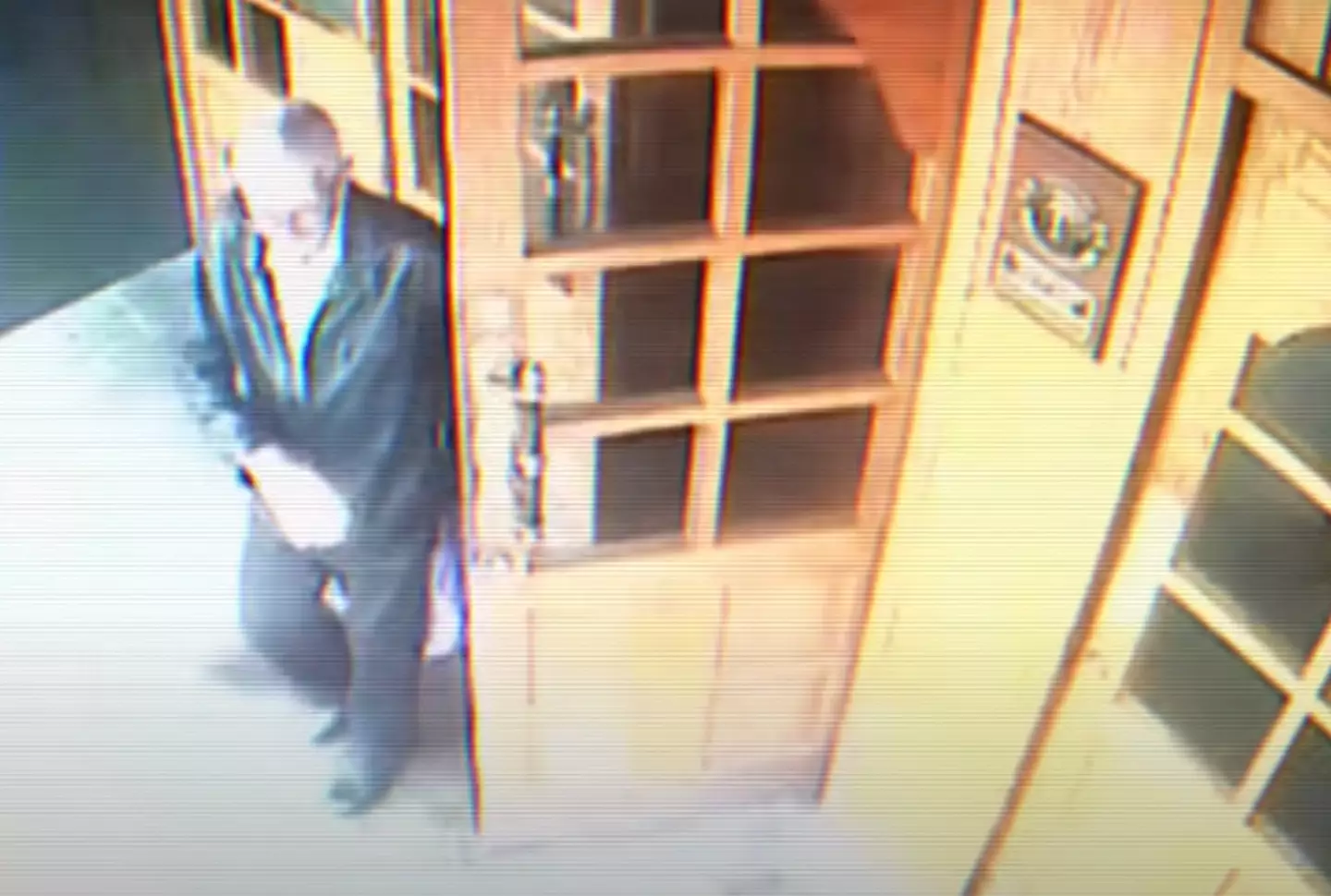 Bergmann seen on one of the occasions he left the hotel with a purple plastic bag (YouTube/@AeonVideo)