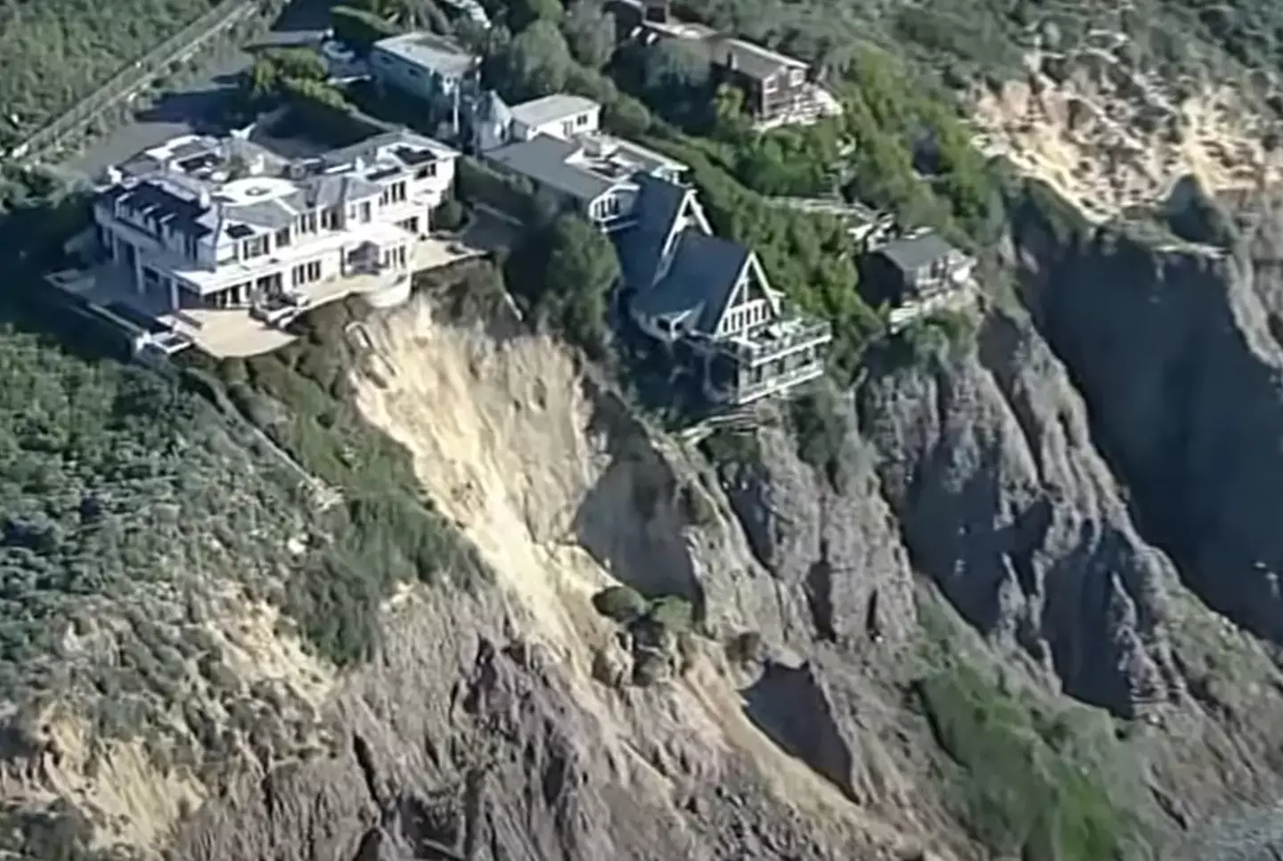 The houses can be seen close to the cliff edge.