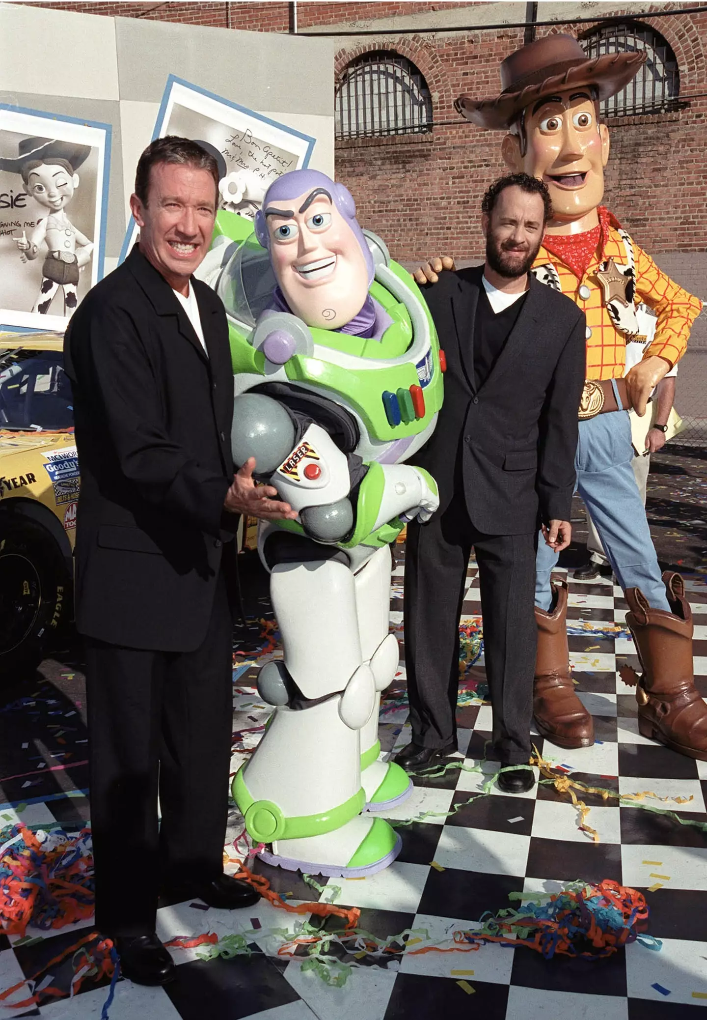 Tim Allen and Tom Hanks with their Toy Story characters in 1995.