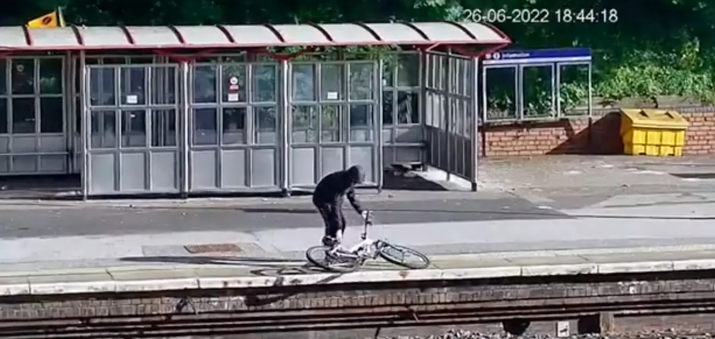 The first person initially placed the bike on the edge of the platform.