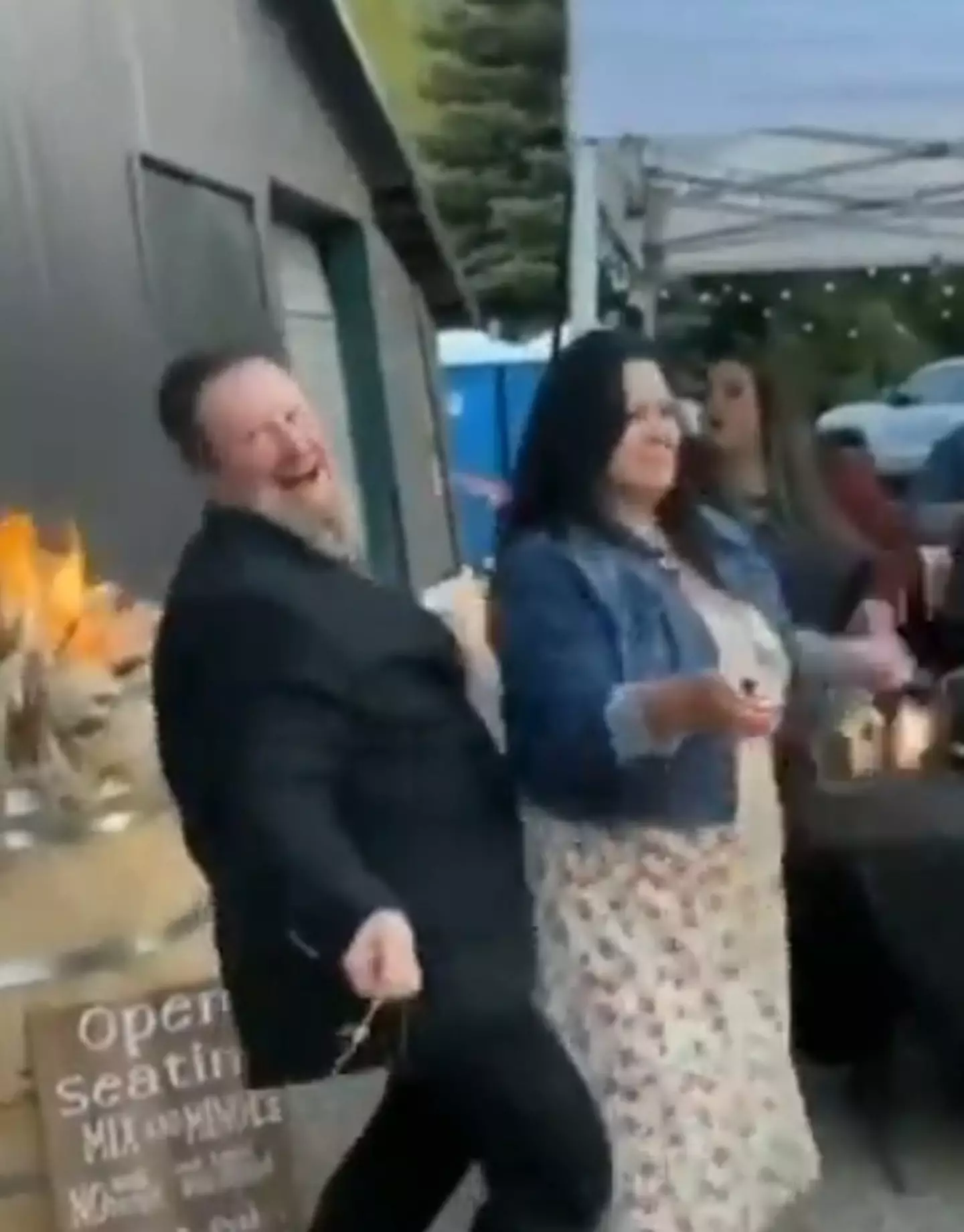 A guest's overzealous dance moves almost caused a wedding venue to go up in flames.