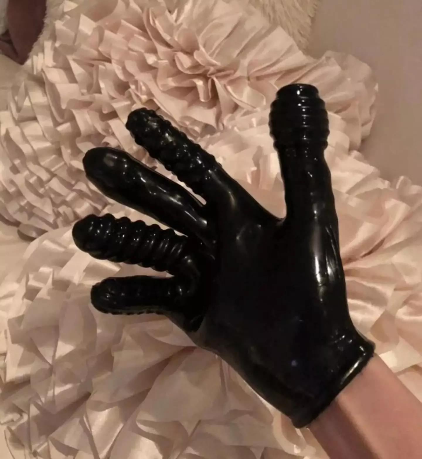 The ribbed glove appears to be an adult toy (House Oversight Democrats)