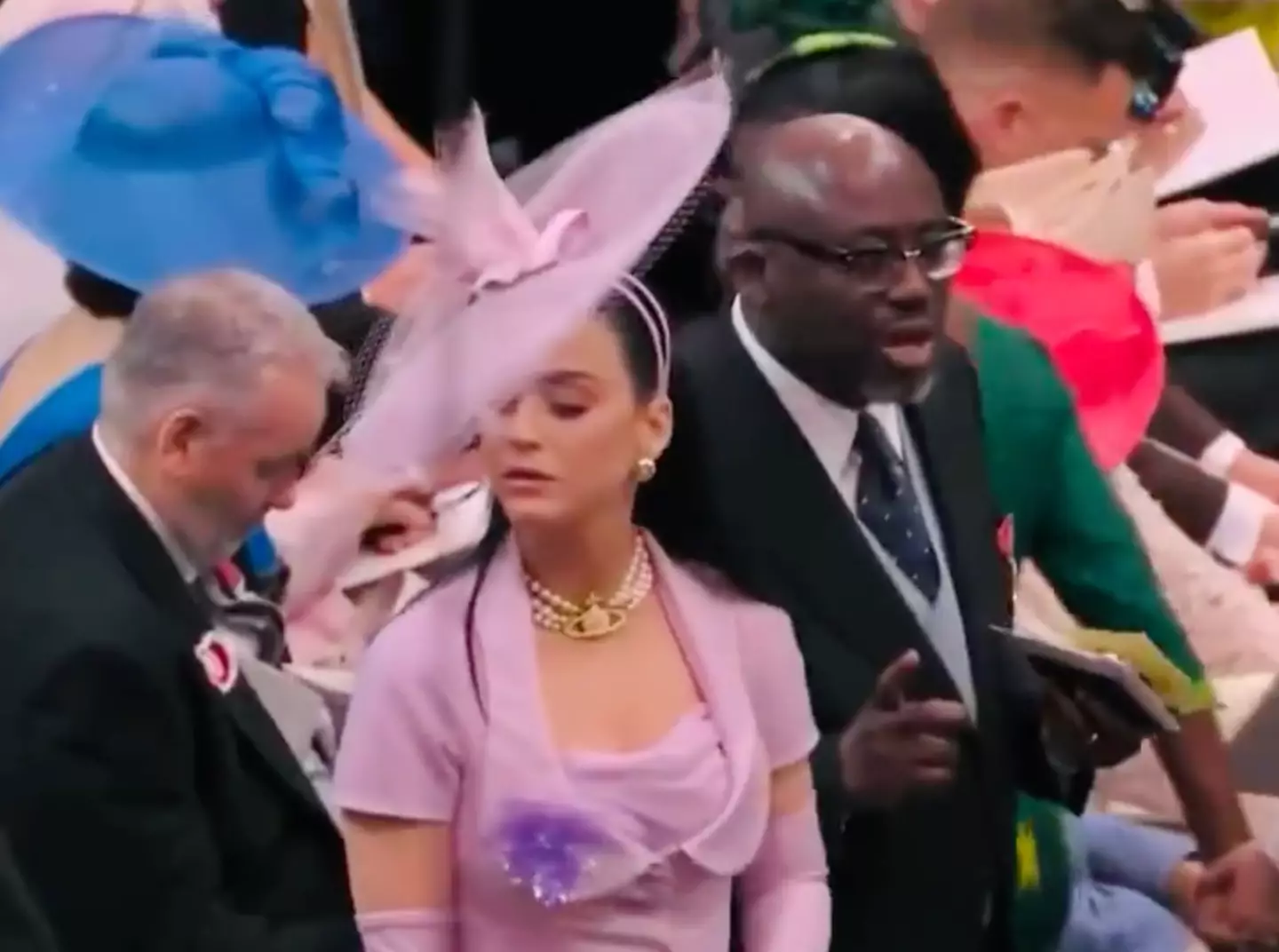 Katy Perry has left viewers in stitches as she struggles to find a seat at Westminster Abbey during King Charles III's historical coronation today (6 May).